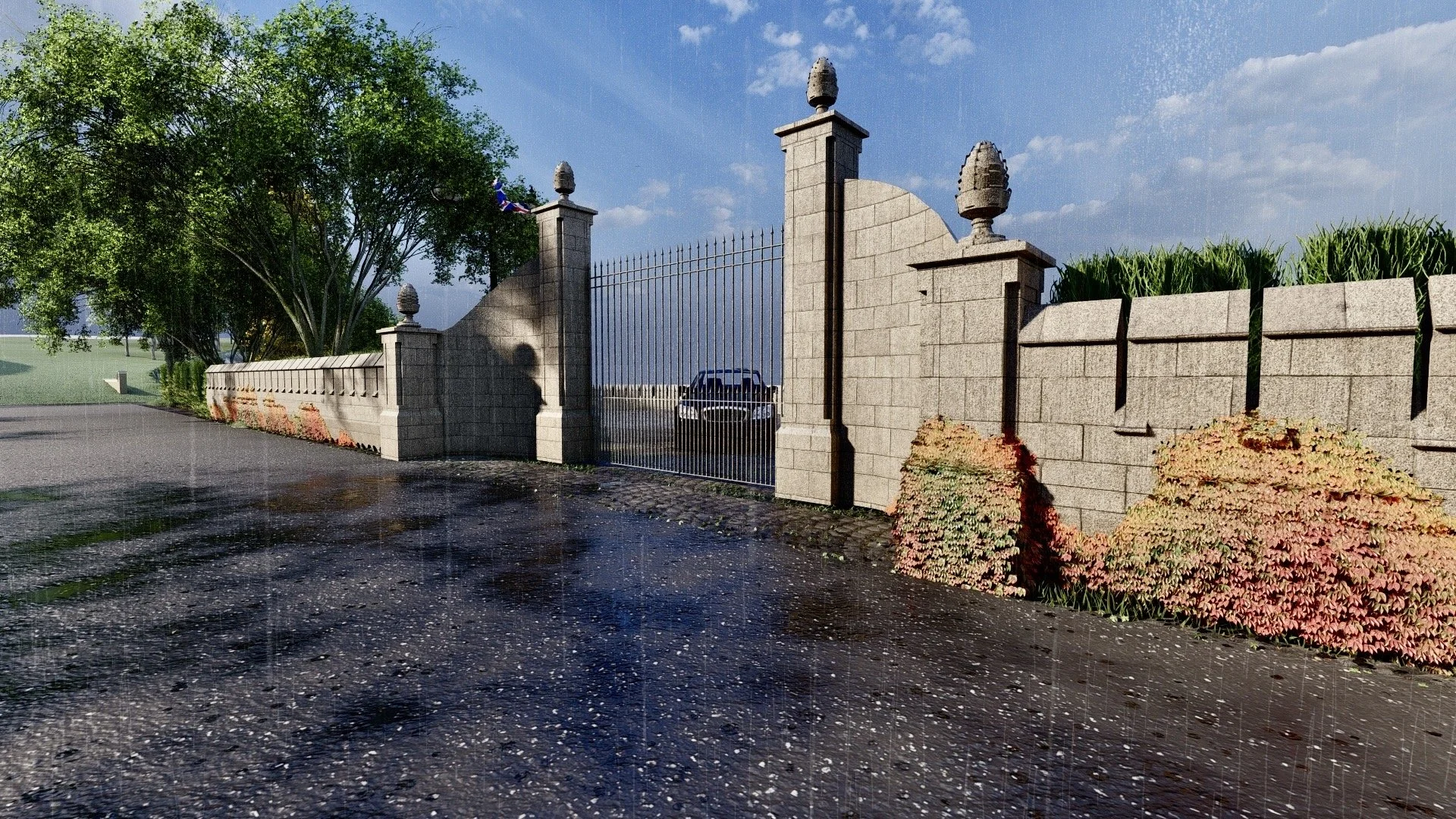 A stone wall gate with decorative urn finials, a black gate, and a parked car behind it, with green trees and bushes, on a partly cloudy day with a wet pavement.