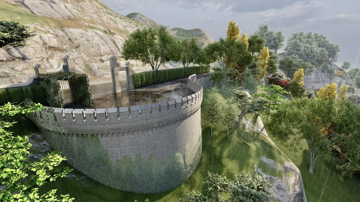 A castle wall with crenellations surrounds a pathway, overlooking a lush landscape with trees, grass, rocks, and a body of water in a hilly, forested area during rain.