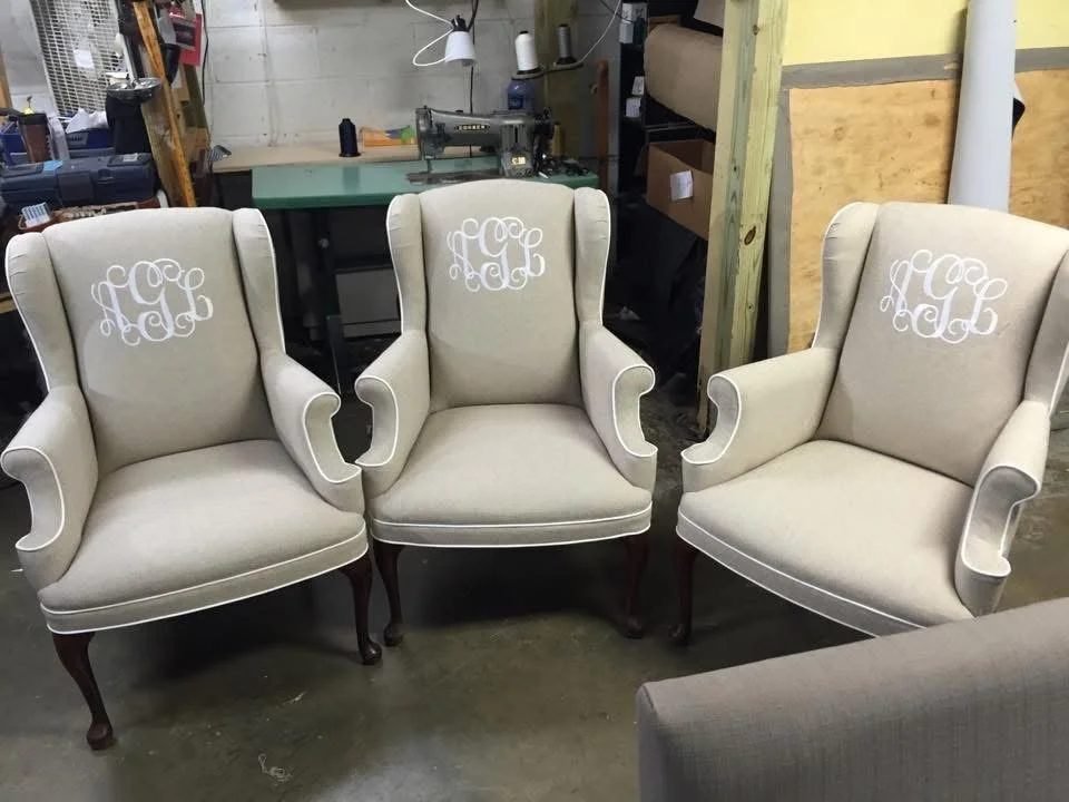 A set of wingback chairs reupholstered in the workshop