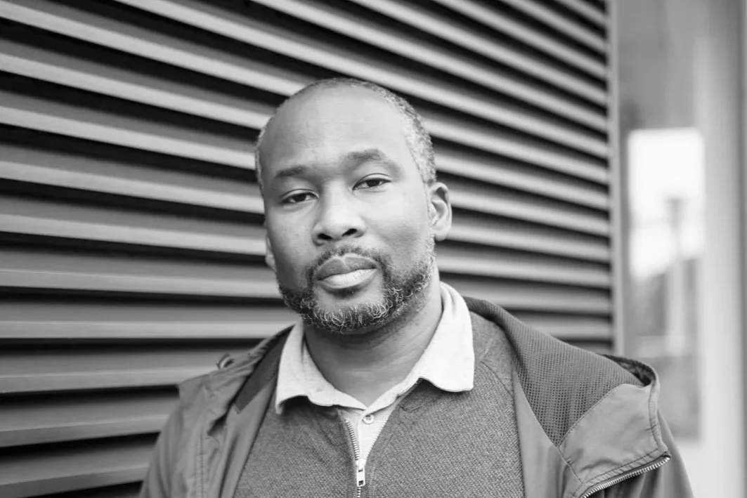 Black and white photo of Isaac Anim Photography © Chris Gloag