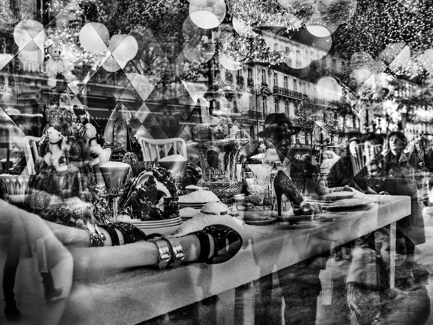 Street view with shop window display of holiday decorations, shoes, and jewelry, reflecting pedestrians and buildings outside.
