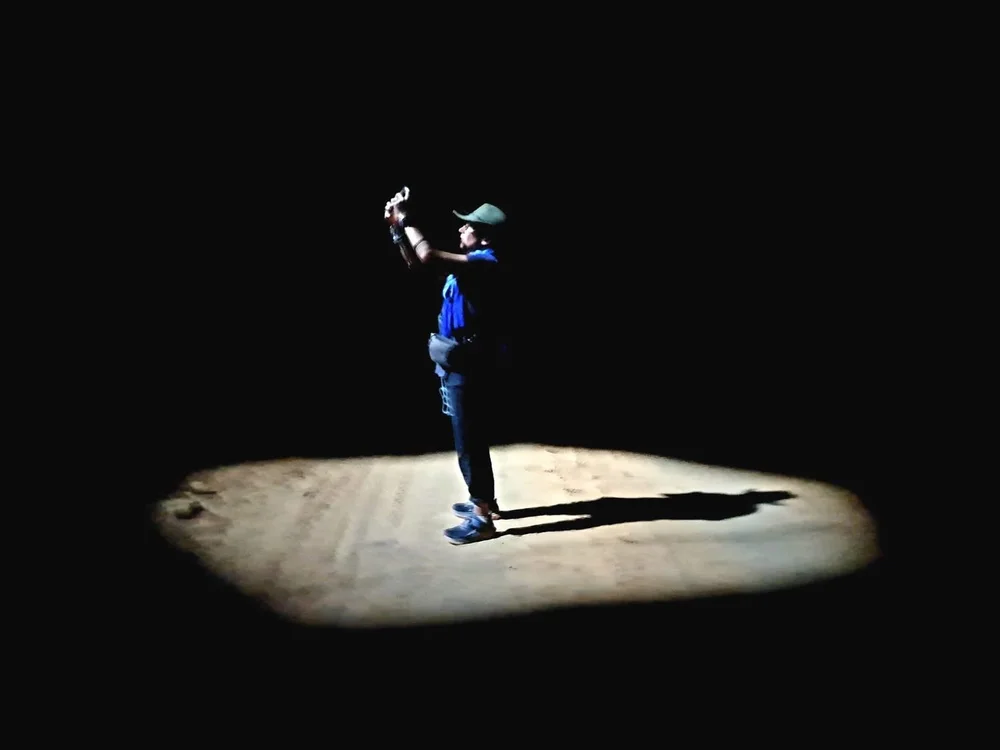 In a shaft of light inside a desert building
