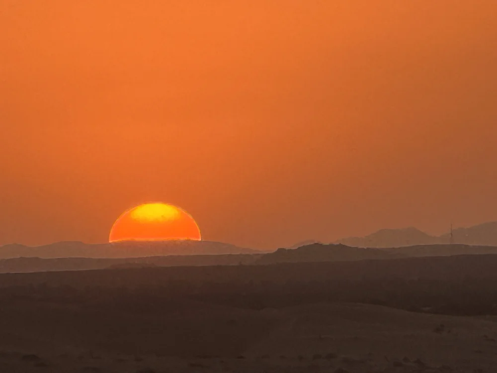 The sun going down over the desert