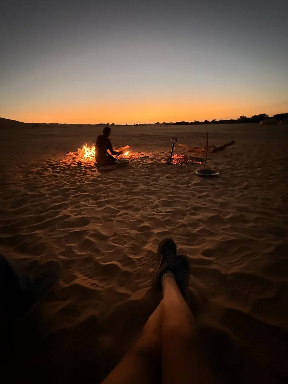Campfire in the dunes after dark