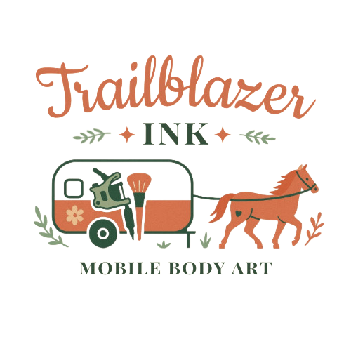 Design with the words "Trailblazer Ink" in large script, featuring a trailer, tattoo machine,  paintbrush, and a horse pulling a trailer, with greenery accents and the words "Mobile Body Art" at the bottom.