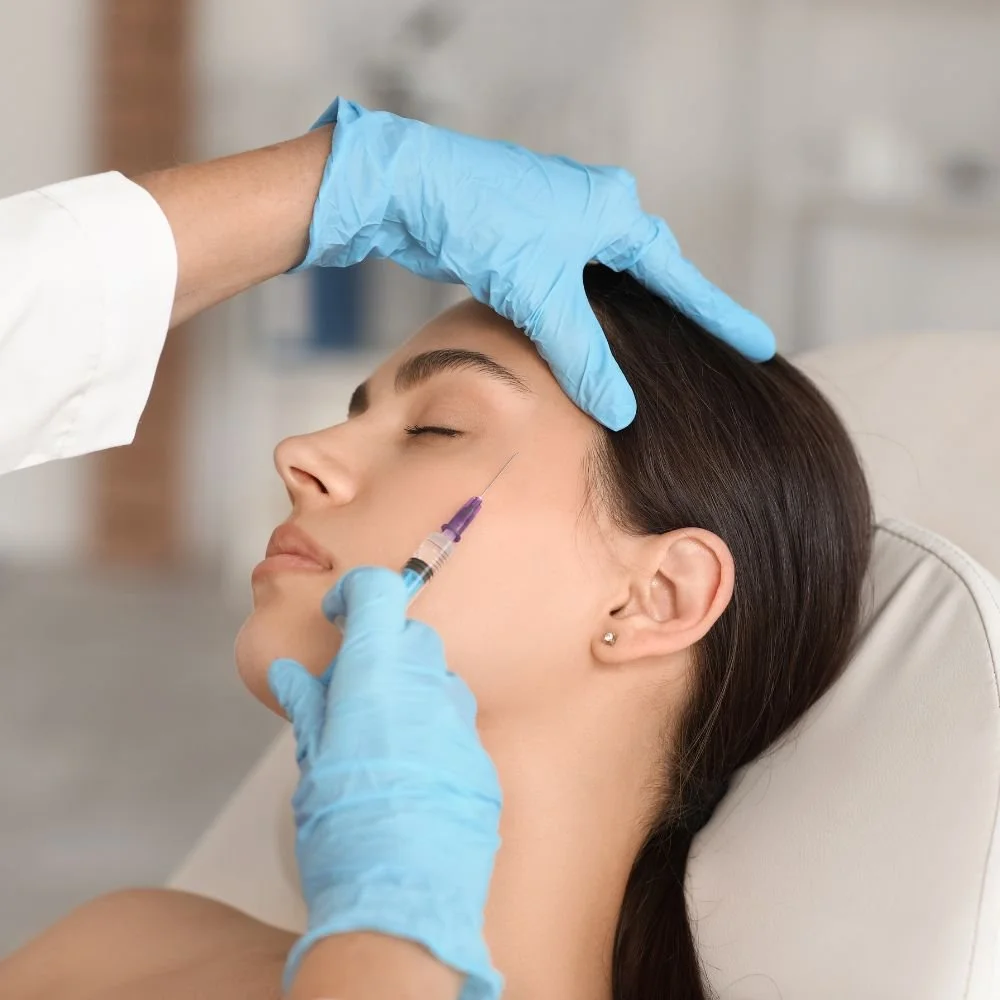 Person receiving a neck massage from a massage therapist.