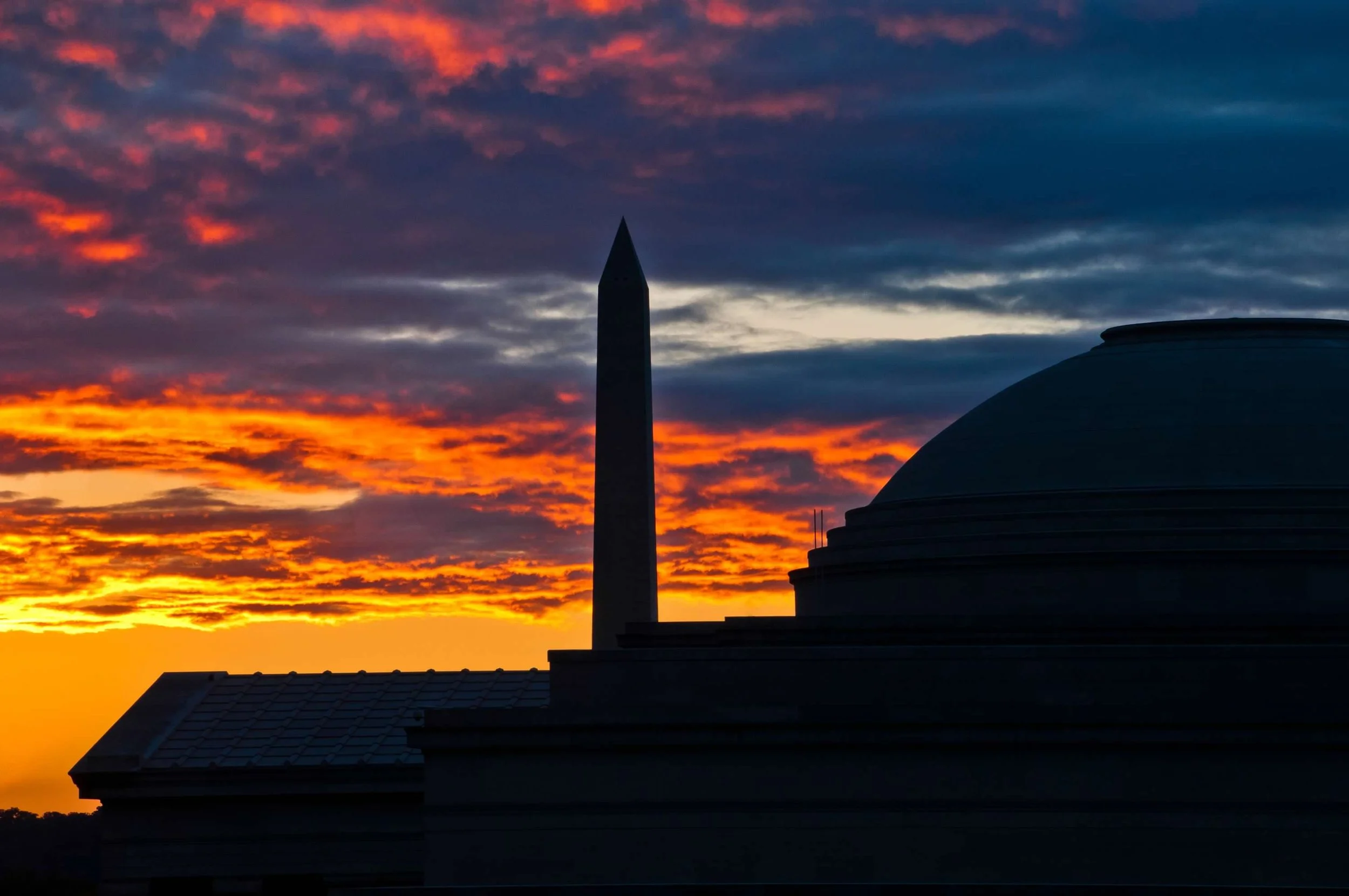 West Building at sunset with Washington Monument