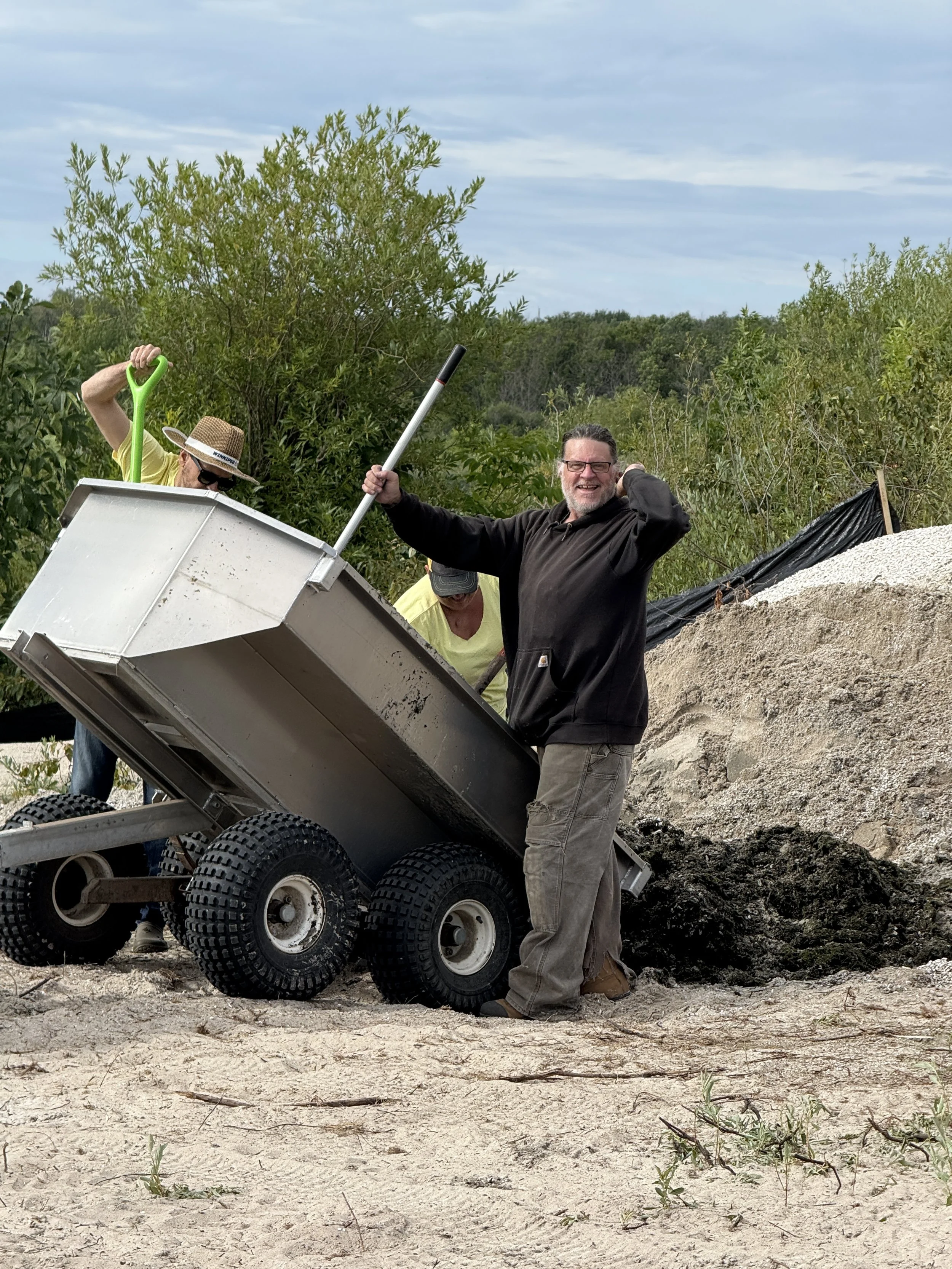 Zebra Mussel Clean-up on Hillside Beach. Many volunteers known as the Mussel Crew showed up to help with personal ATVs, trailers, and muscle.