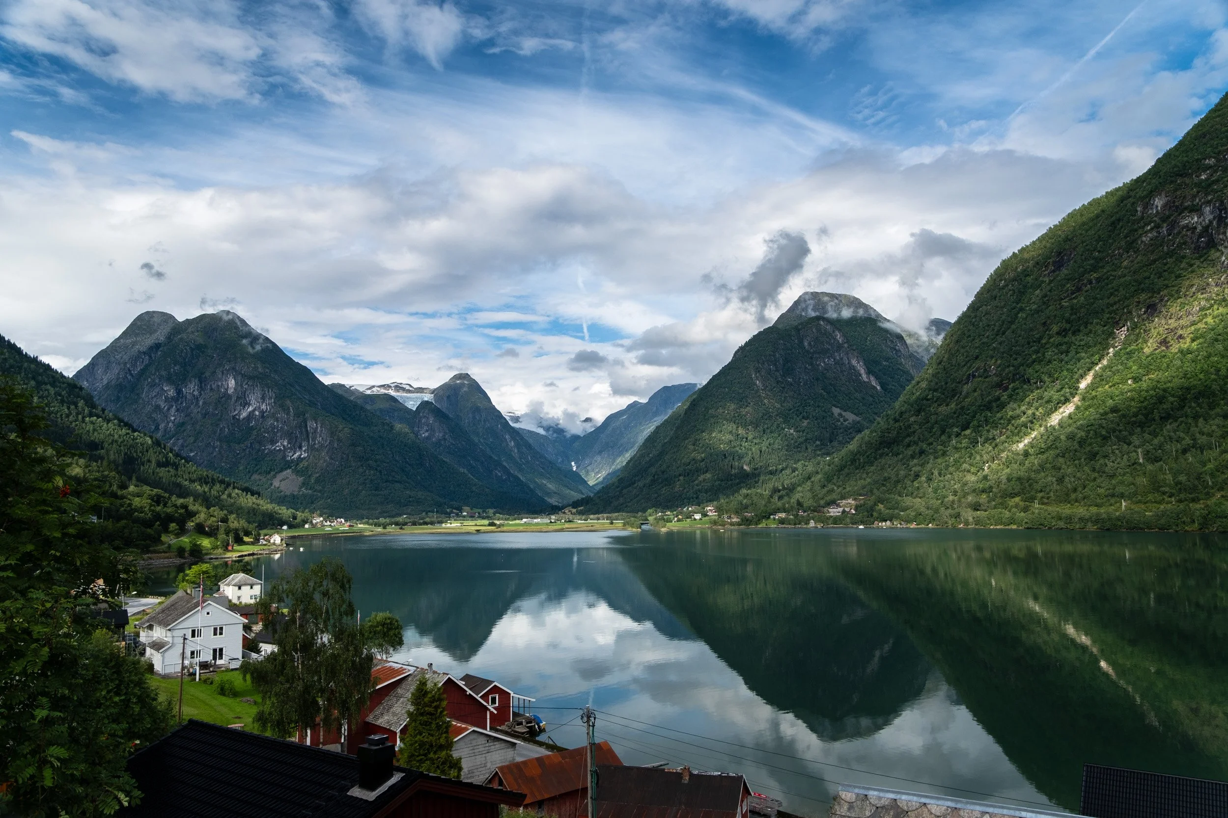 Norway: Landscape of a peaceful fjord with reflections on the water. Outdoor reportage, territorial promotion, and sustainable tourism by Guillaume Donsimoni.