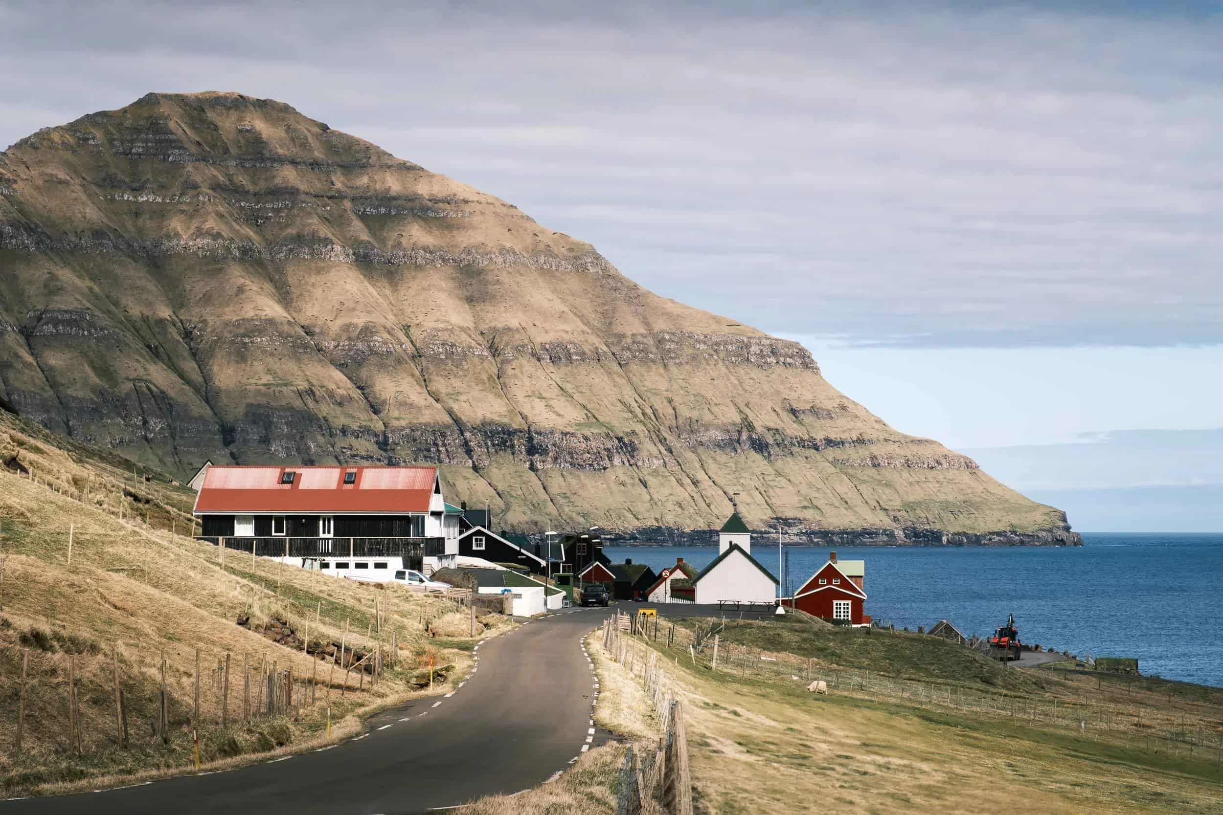 typical fishing village in the Faroe Islands facing the fjord