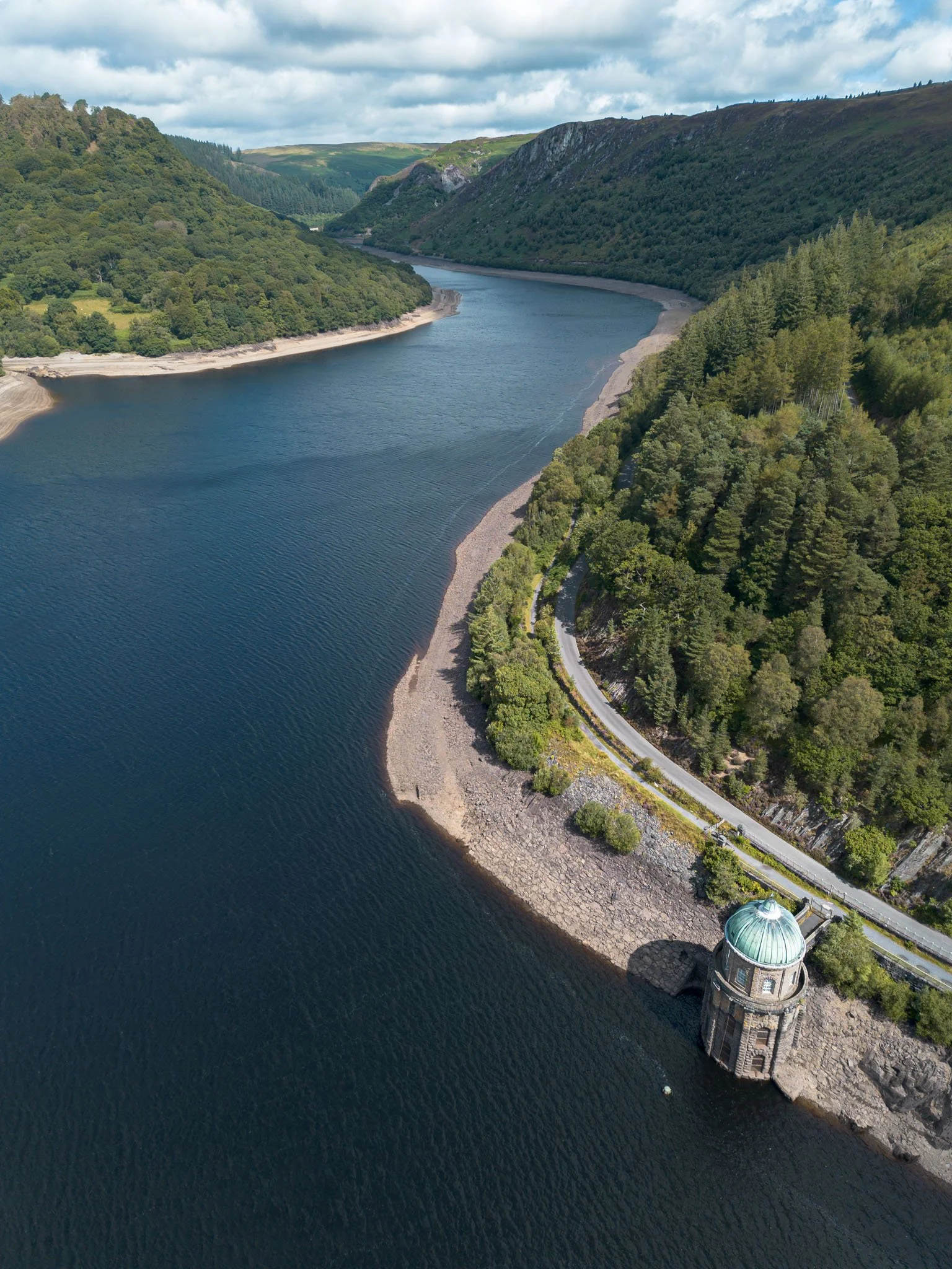 Aerial view of a reservoir lake in Wales. Outdoor reportage, regional promotion, and sustainable tourism by Guillaume Donsimoni.