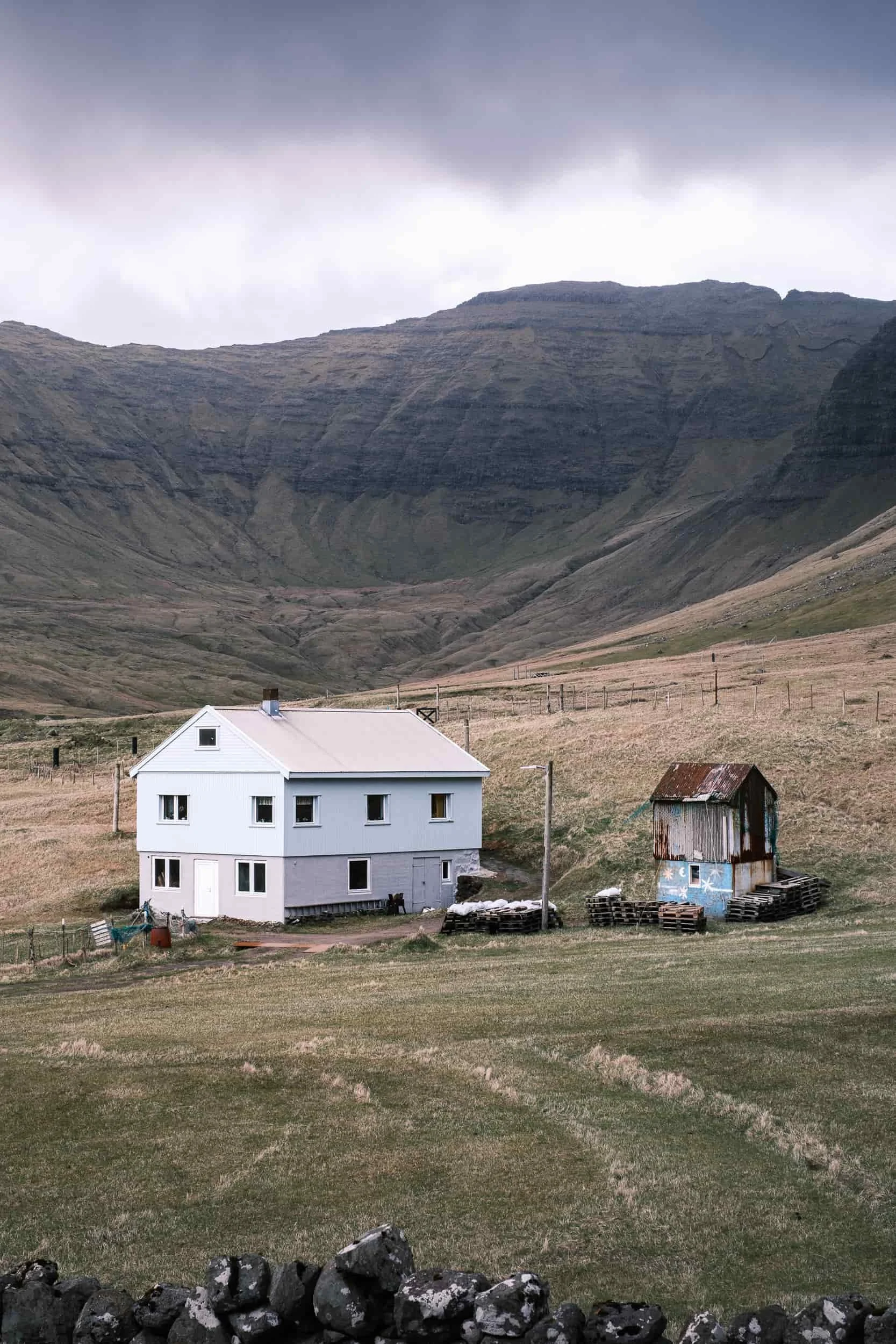 The spirit of slow tourism: traditional dwellings tucked away in the green valleys of the Faroe Islands.