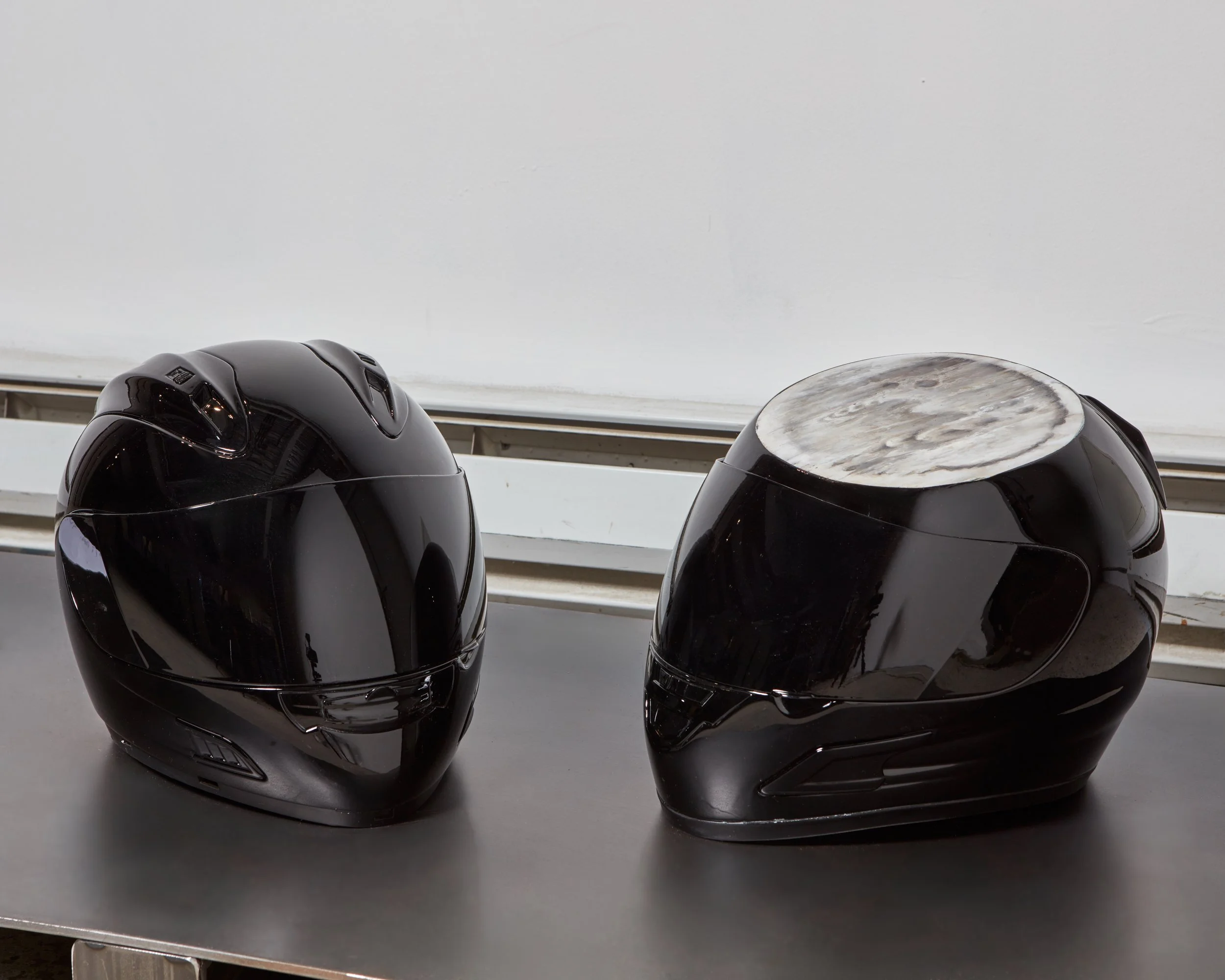  Wells Watson  Symphysis, 2025 
 Sectioned motorcycle helmets, acrylic 