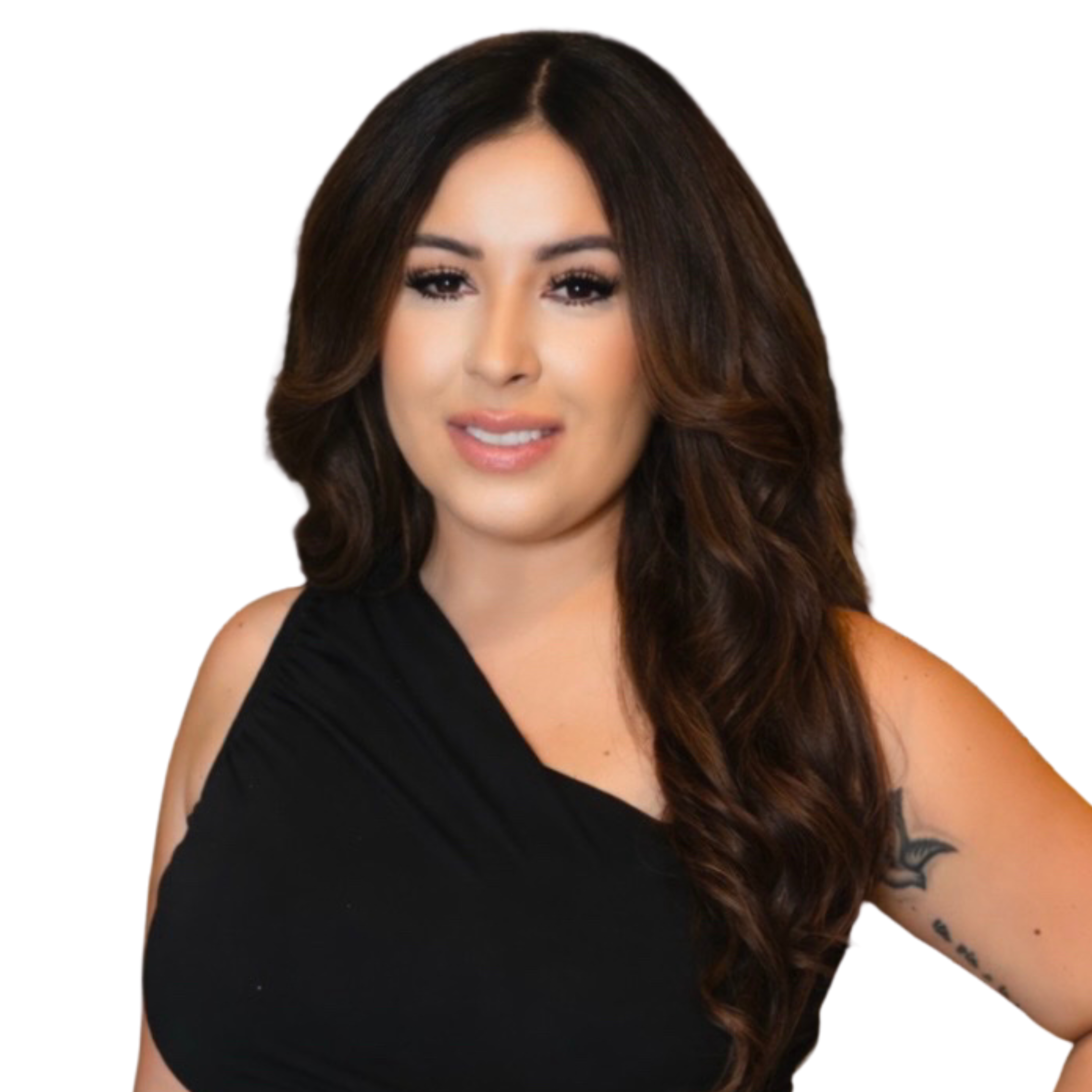 Portrait of a woman with long wavy brown hair wearing a black sleeveless top, smiling softly, with a tattoo of a bat on her upper arm, against a plain white background.