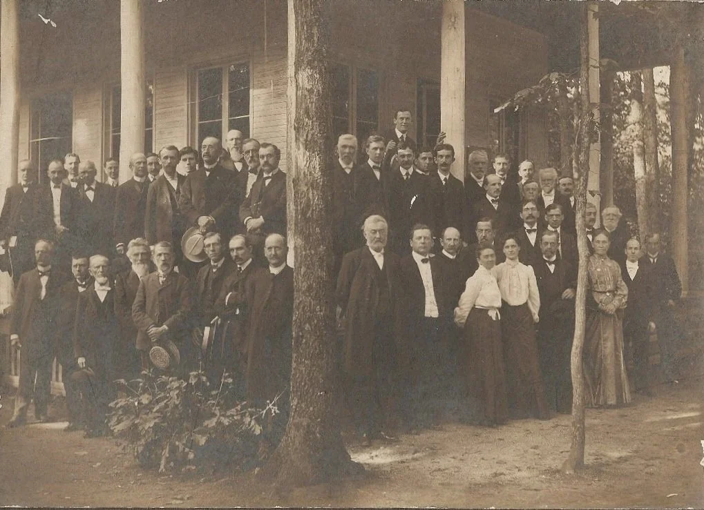 A large group of men and women posing outside Circle Building PA Chautauqua