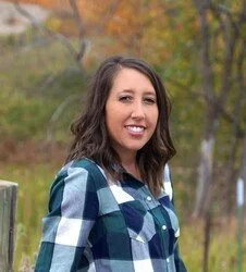 Placeholder image of a user profile icon with a circular silhouette of a person on a gray background.