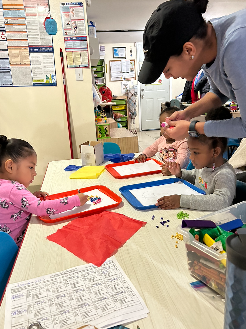 Children enjoying arts and crafts during daycare enrichment time