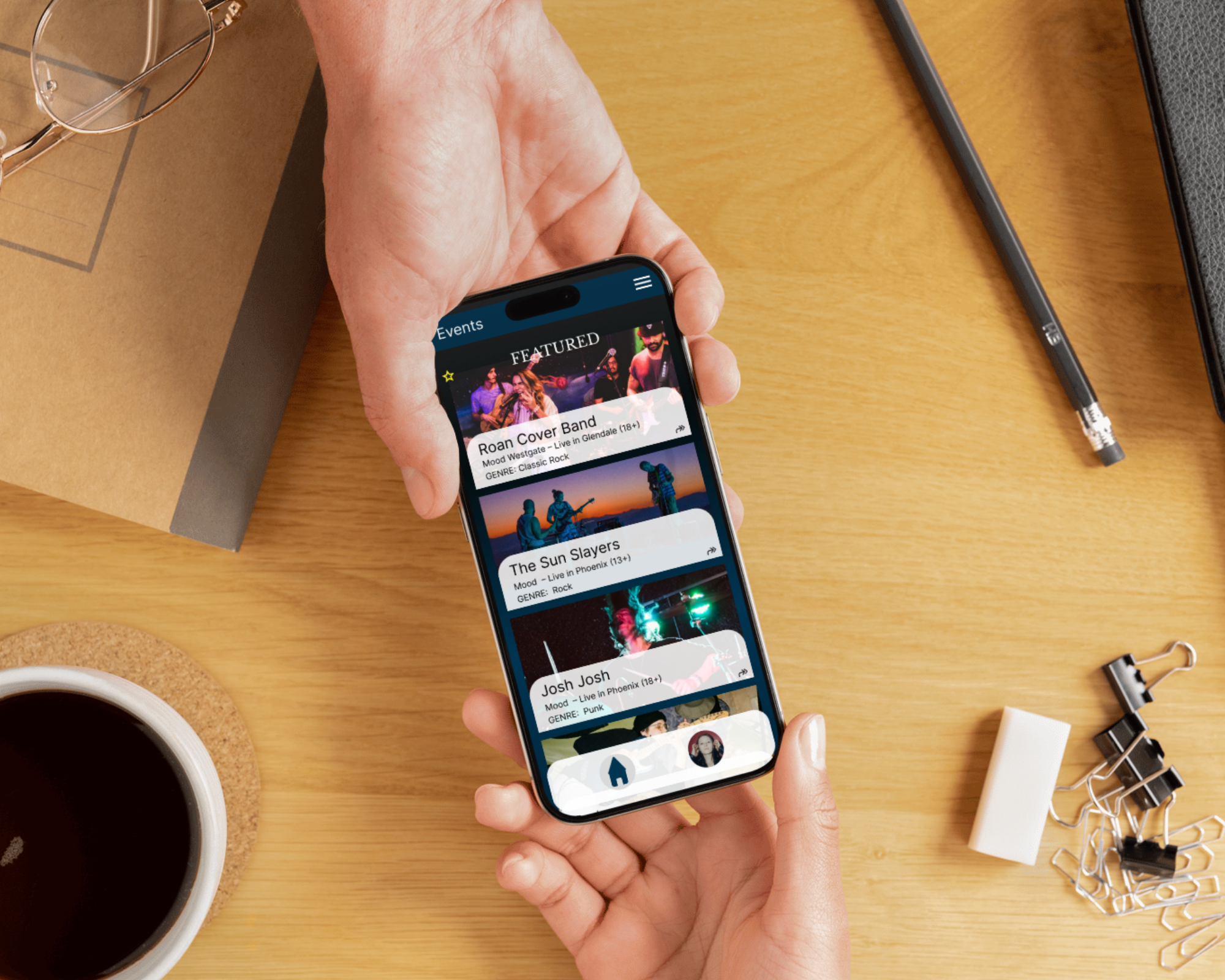 Hands passing a phone with images of concert options