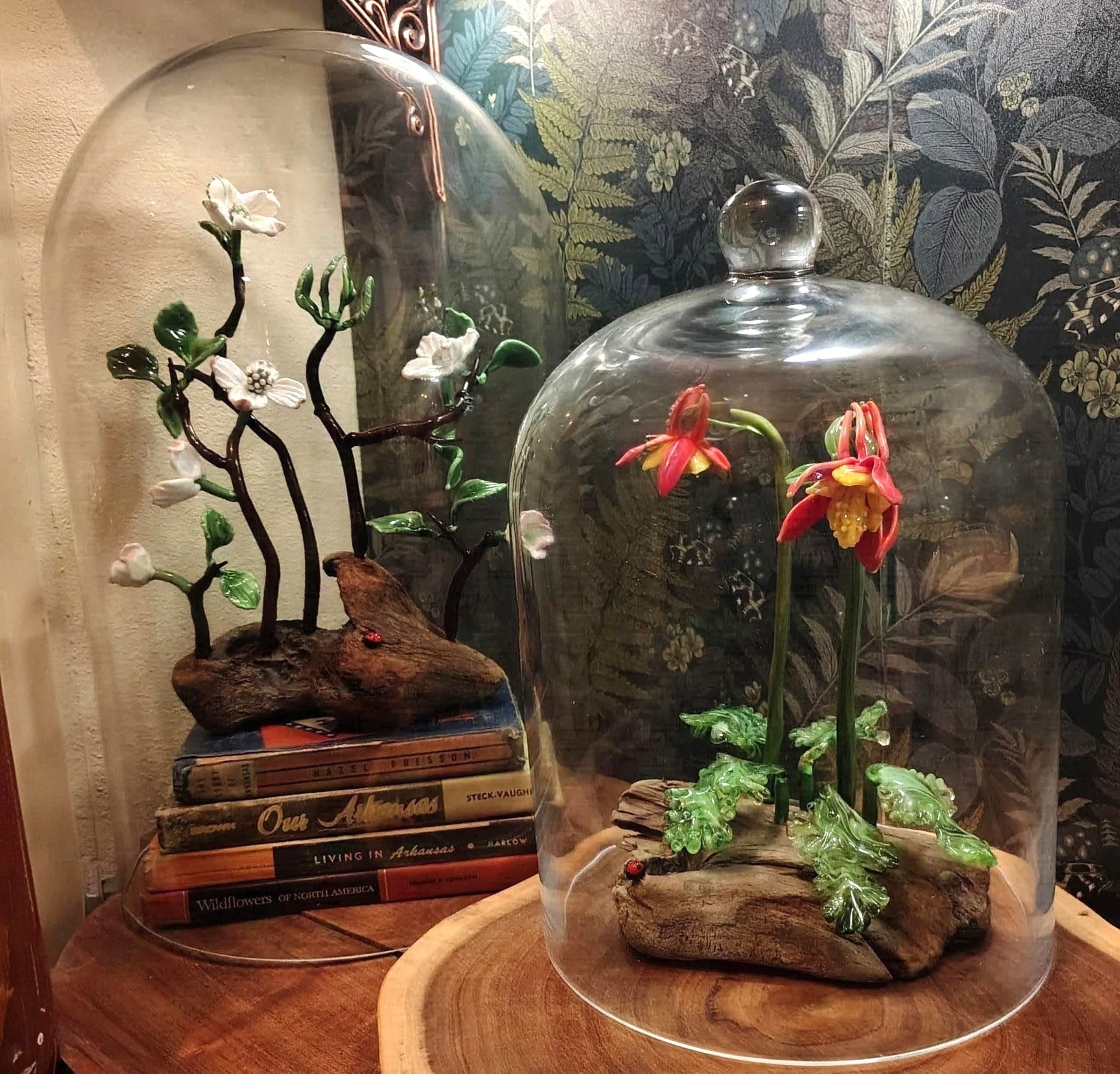 Two flameworked floral sculptures by Vicki Schneider on display at her collector's home