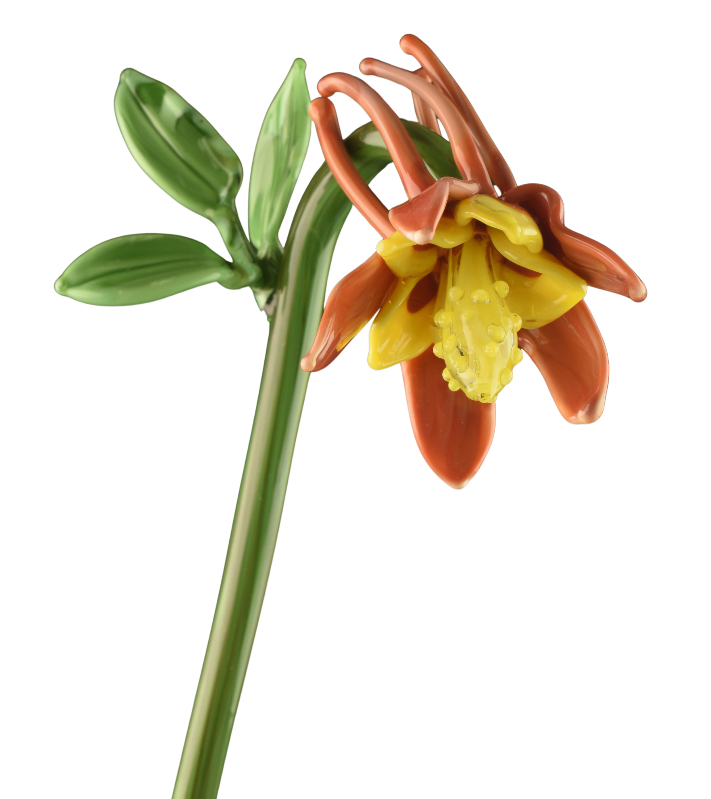 A glass sculpture of a flowering plant with green leaves and a colorful flower with yellow, orange, and pink petals against a black background.