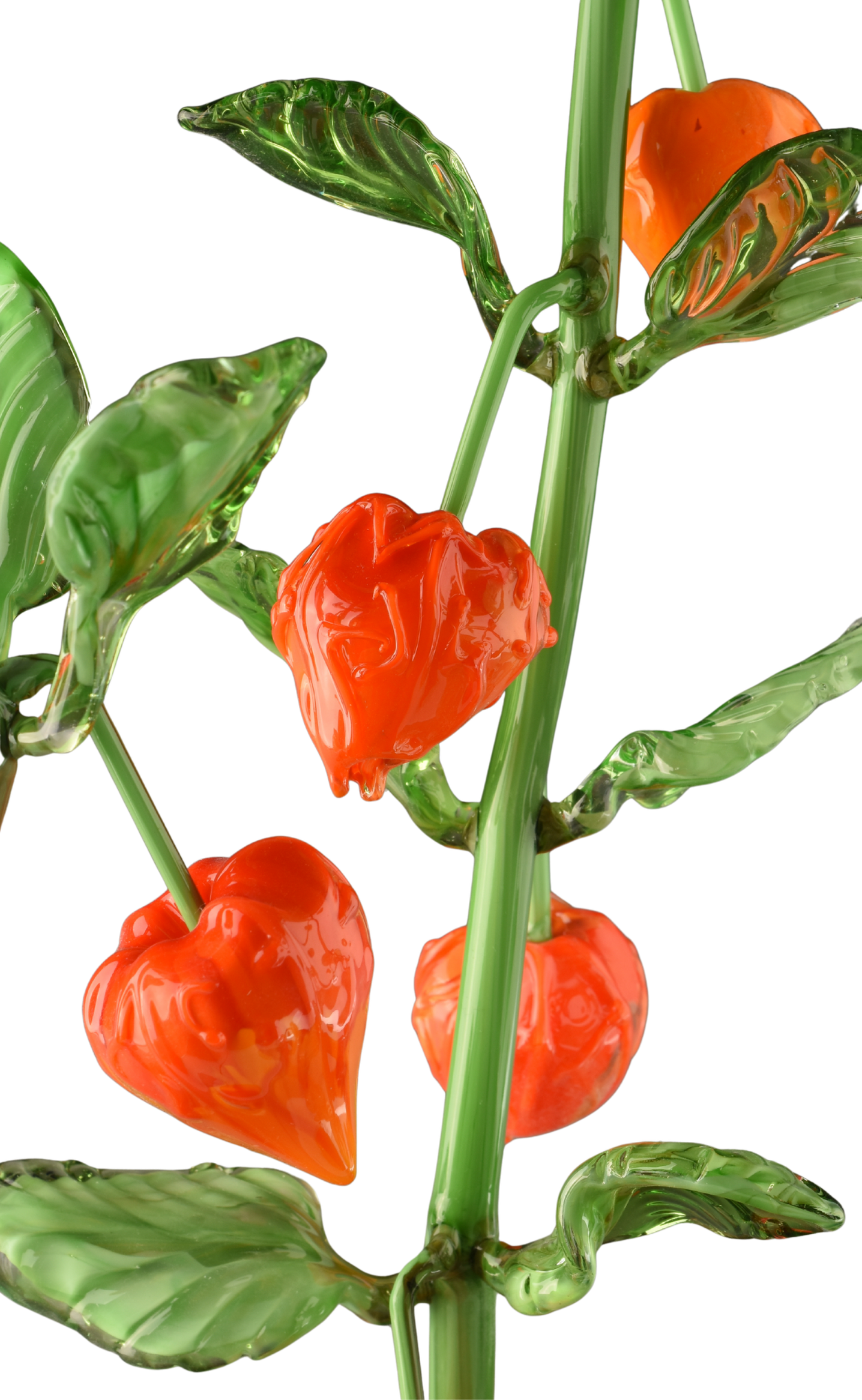 A close-up of a decorative glass plant featuring orange bell-shaped flowers, green stems, and leaves.