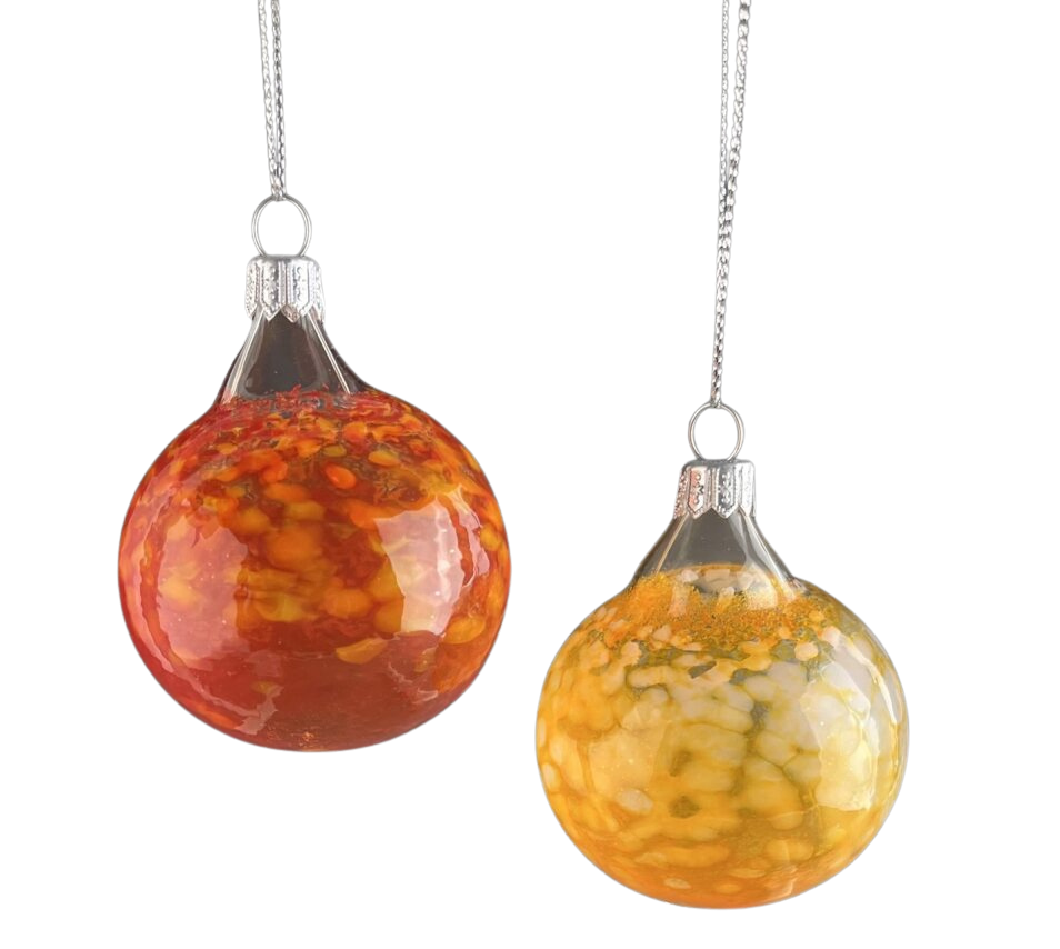 Two glass ornaments with orange and yellow marbled patterns hanging from silver chains.