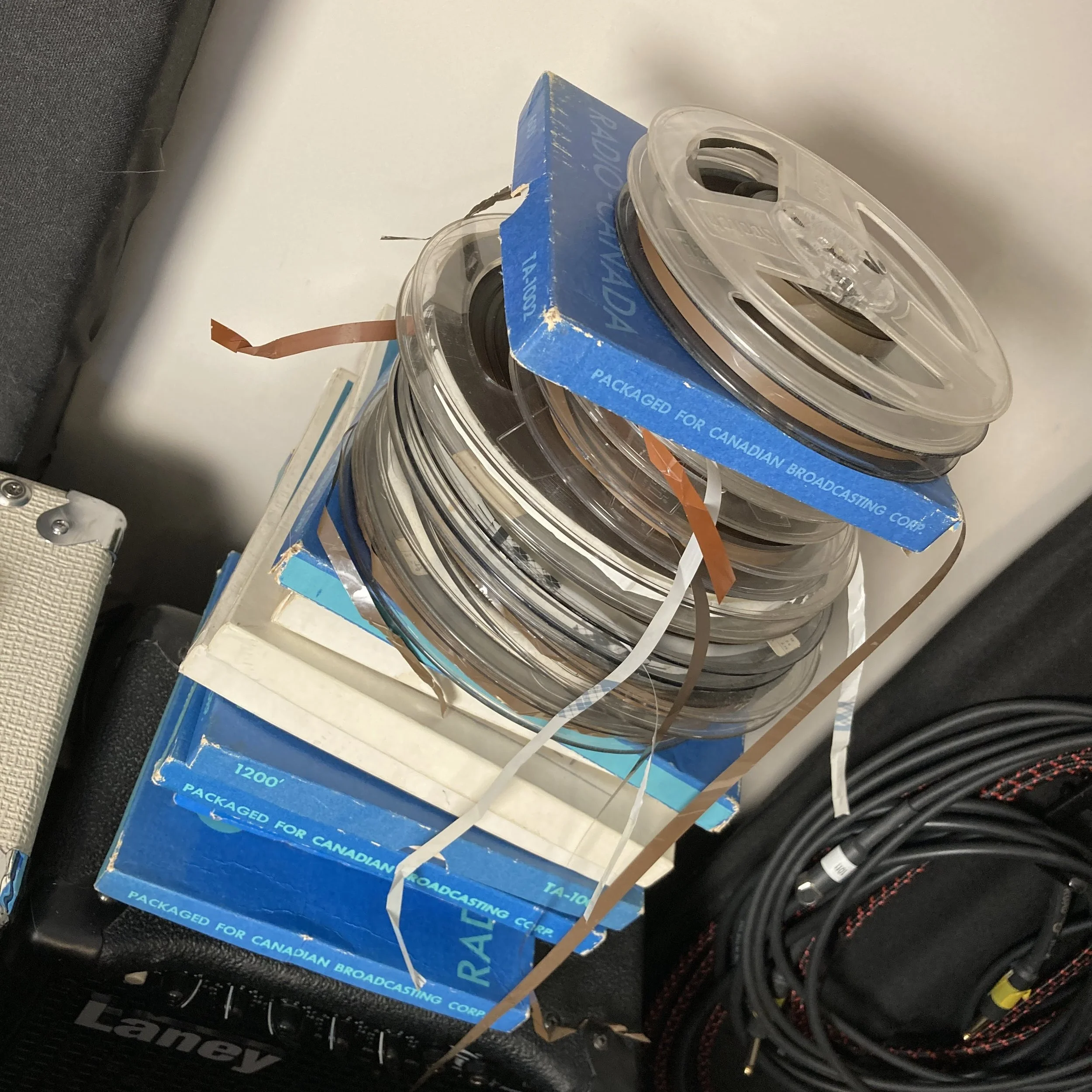 A stack of old quarter-inch tape reels awaits digitizing in London, Ontario.