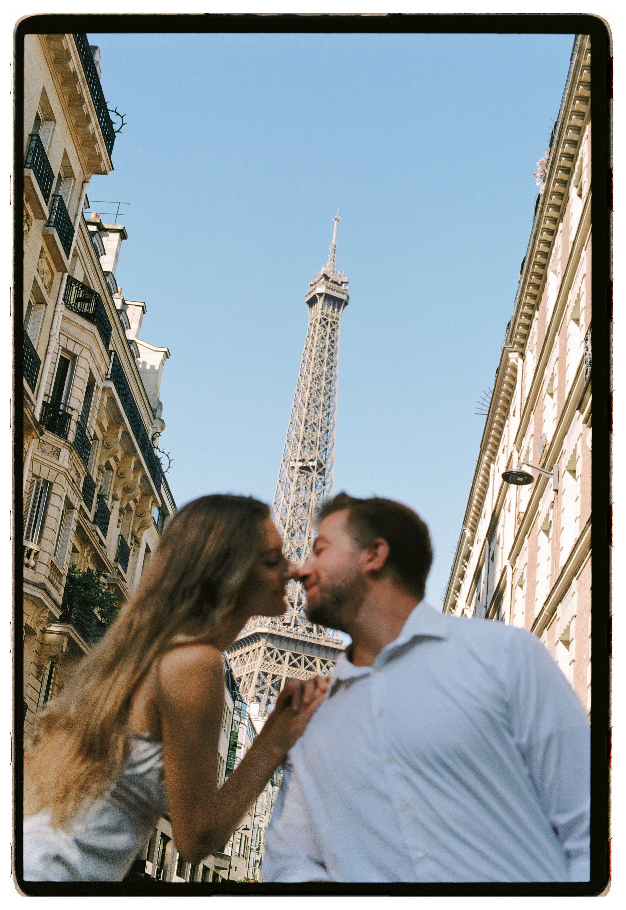Engagement couple photoshoot in Paris on film and digital. Champ de Mars, Eiffel Tower. Wedding photographer, destination wedding photographer, Paris wedding photographer. South of France, Europe, Italy, Spain photographer.