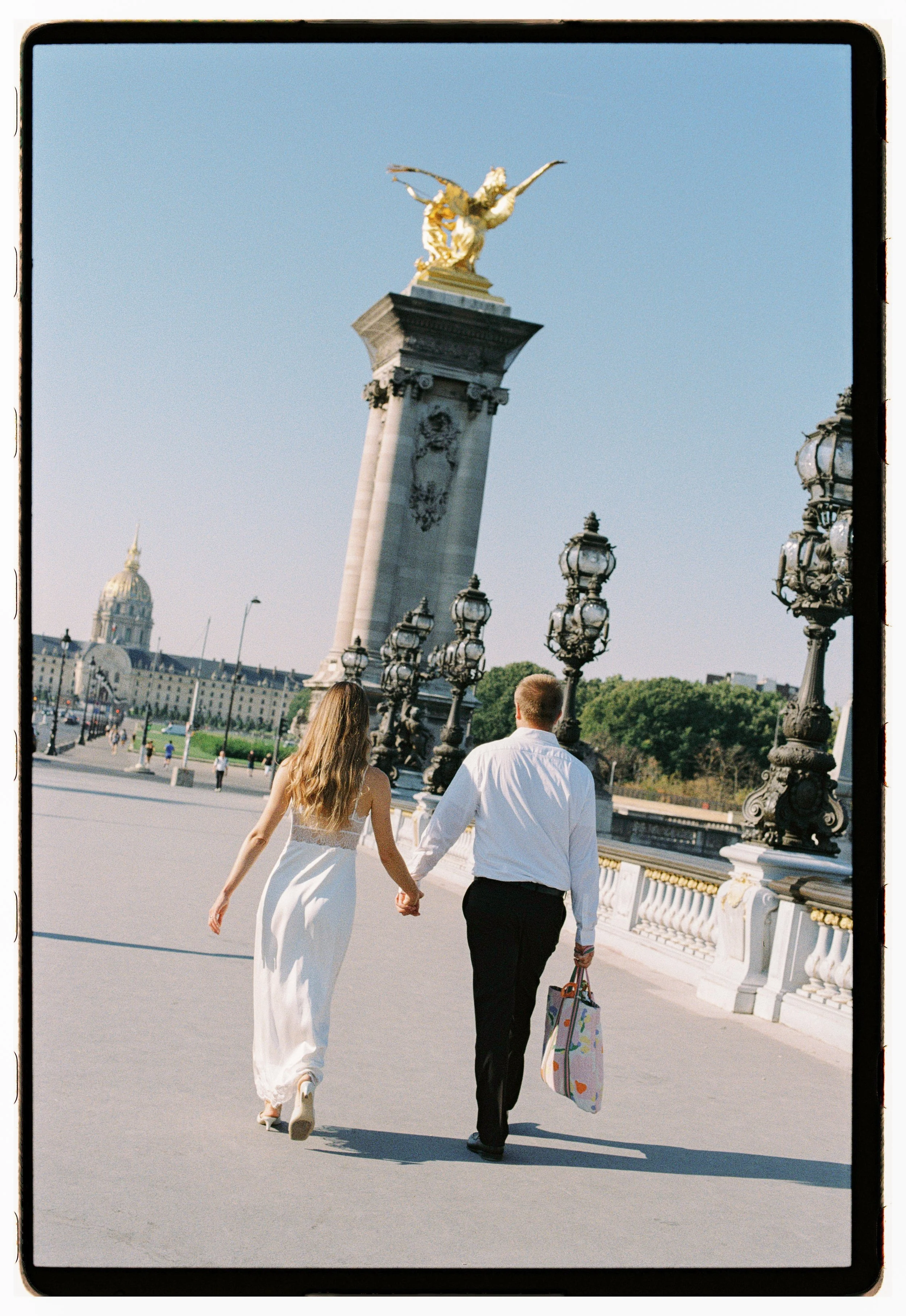 Engagement couples photoshoot in Paris on film and digital. Champ de Mars, Eiffel Tower. Pont Alexandre III. Wedding photography, Europe, destination weddings. Summer film photos.