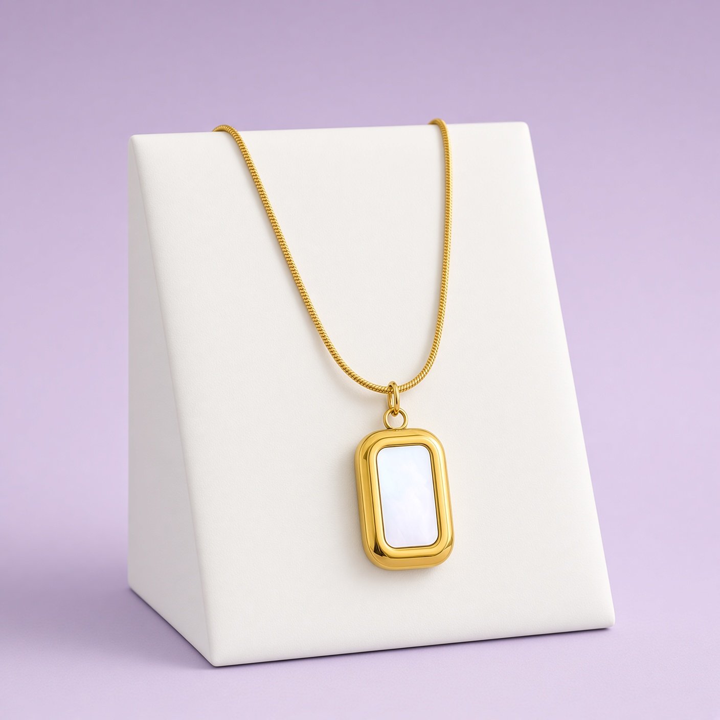 Gold rectangular white shell pendant necklace from Laroc Jewel Christmas Box Four on white bust