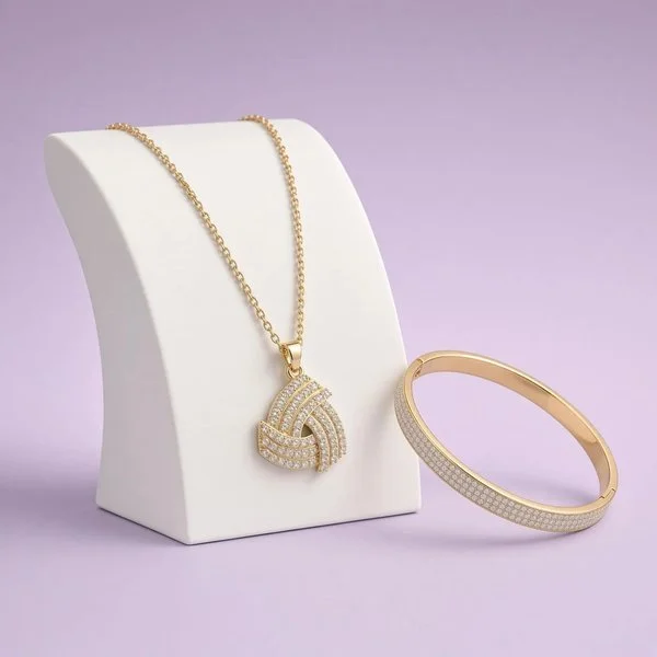18-karat gold-plated necklace with a bright pendant and matching bracelet on purple, a Laroc Jewel Christmas gift set and gift idea for her.