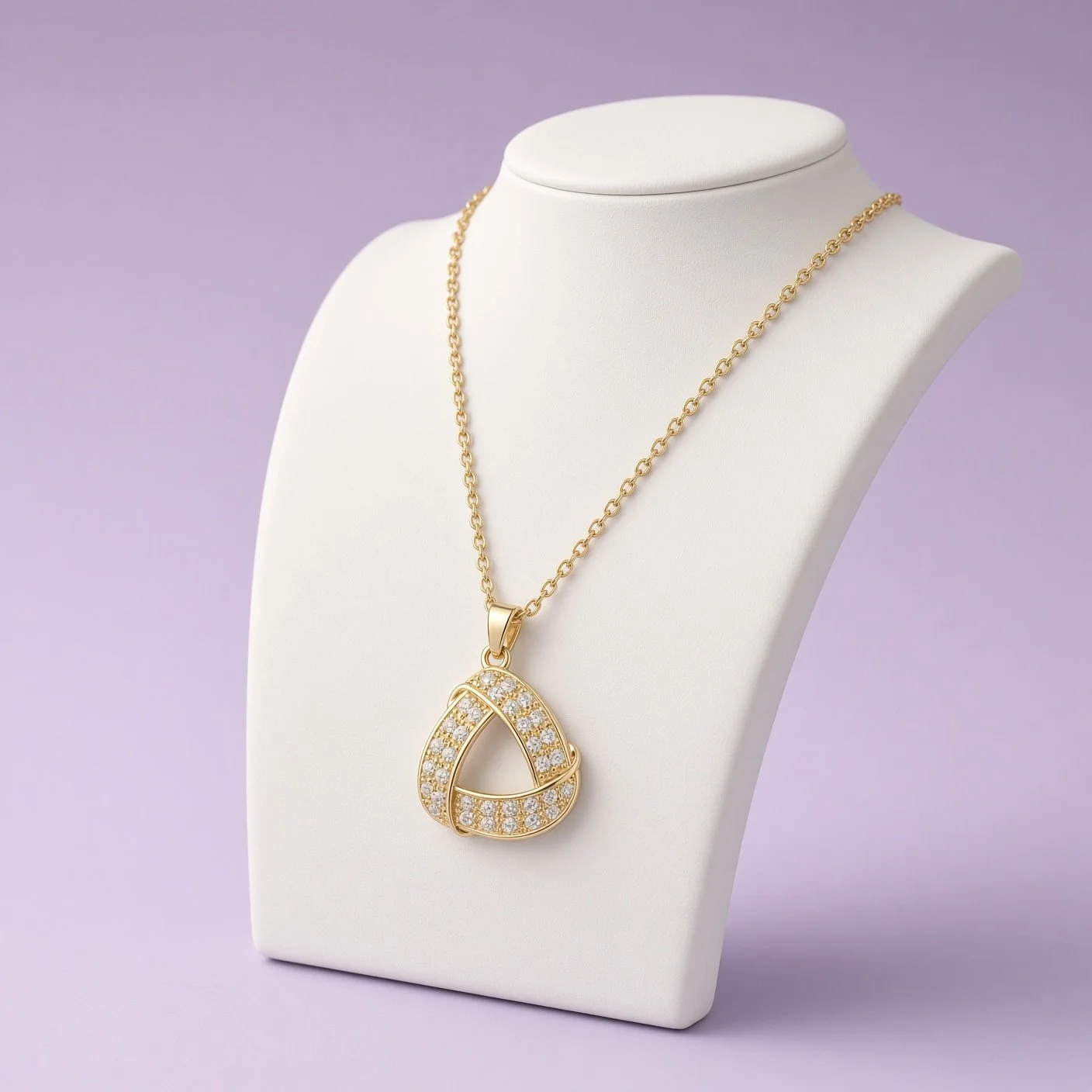 Gold open triangle pendant necklace with stones from Christmas Box Five on white bust
