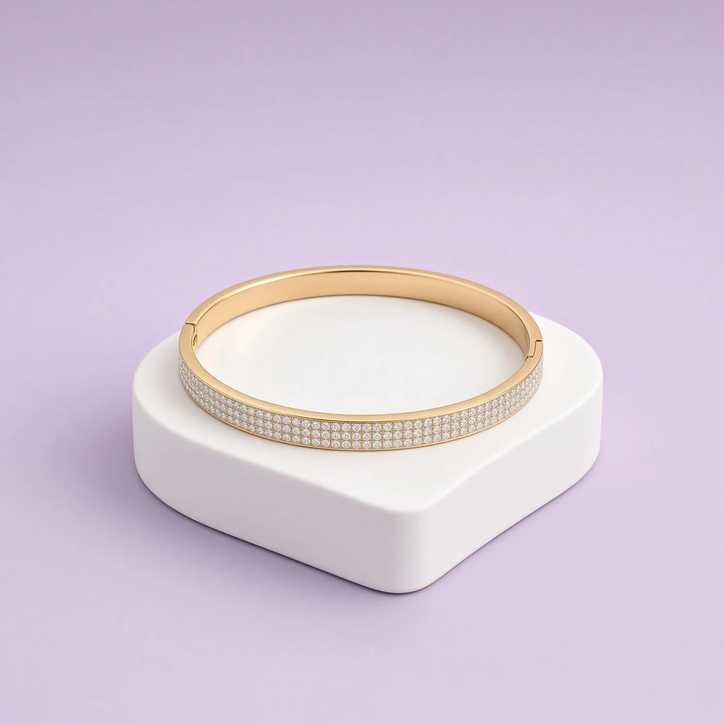 Gold hinged bangle with full stone row from Laroc Jewel Christmas Box Two on white stand
