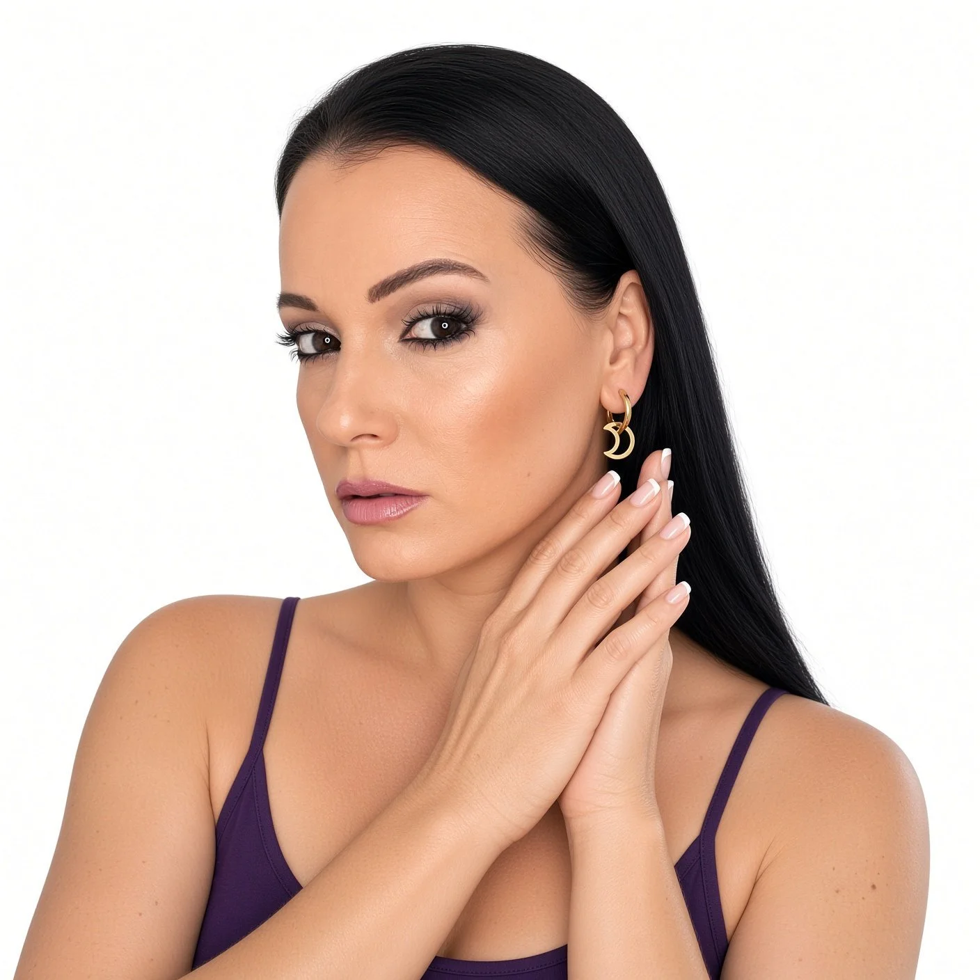 Model wearing gold-plated crescent moon hoop earrings