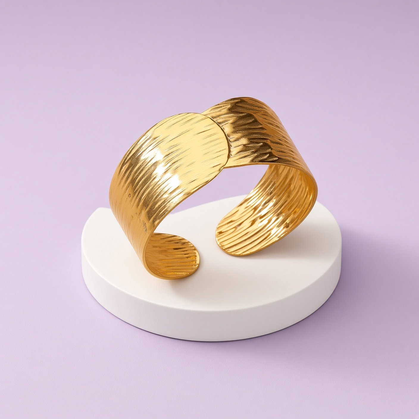 Gold-plated wide open bangle with a textured surface