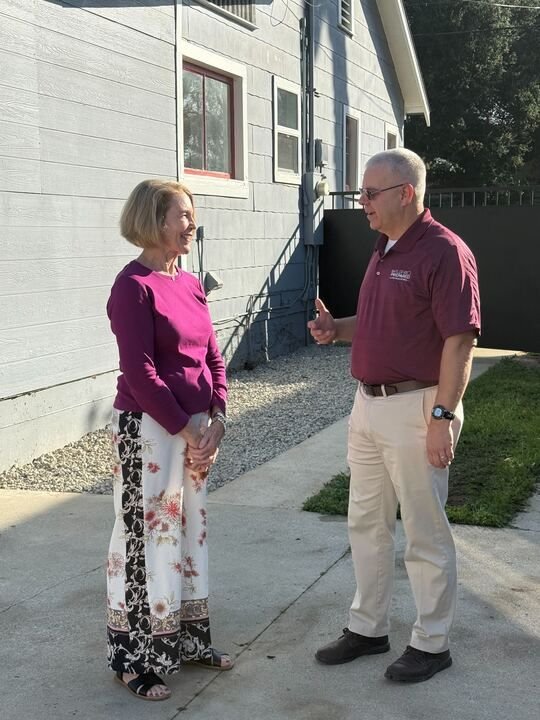 Home owner and Neighbor collaborating on fire resilience