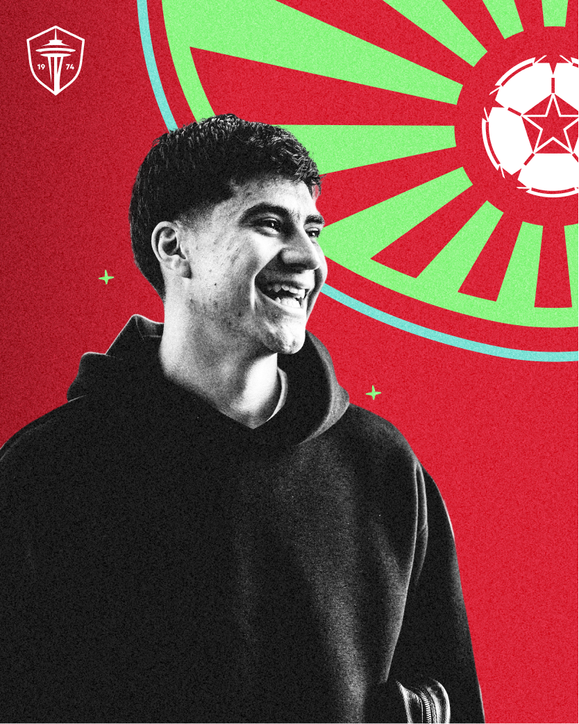 A black and white photo of a smiling young man in a hoodie against a festive red and green background featuring a soccer ball and the Seattle Sounders FC logo.