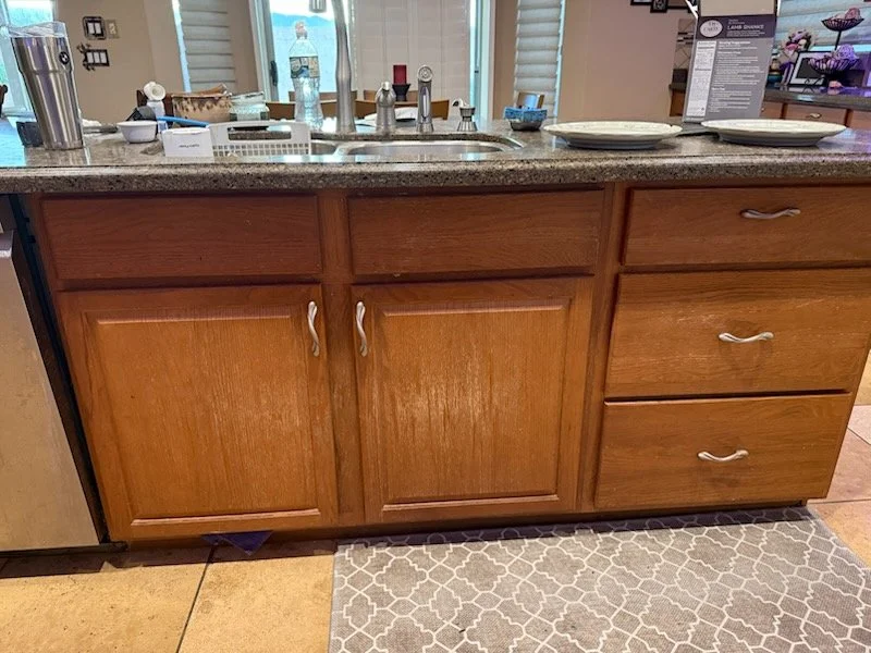 A new client called asking to do some refinishing on their kitchen sink doors.  The finish was worn down to bare wood. (Surprise, AZ)