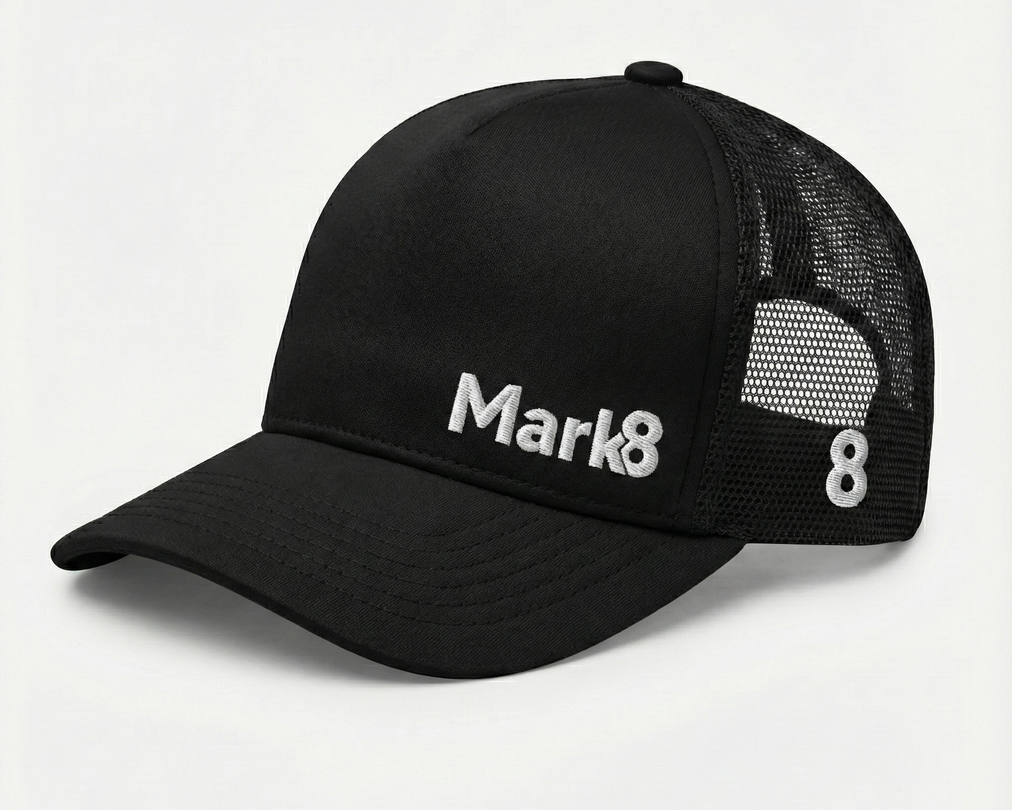 Black Richardson-style trucker hat with structured front panels, breathable mesh back, and raised embroidery. A clean, versatile option for brands prioritizing everyday visibility and wide appeal.