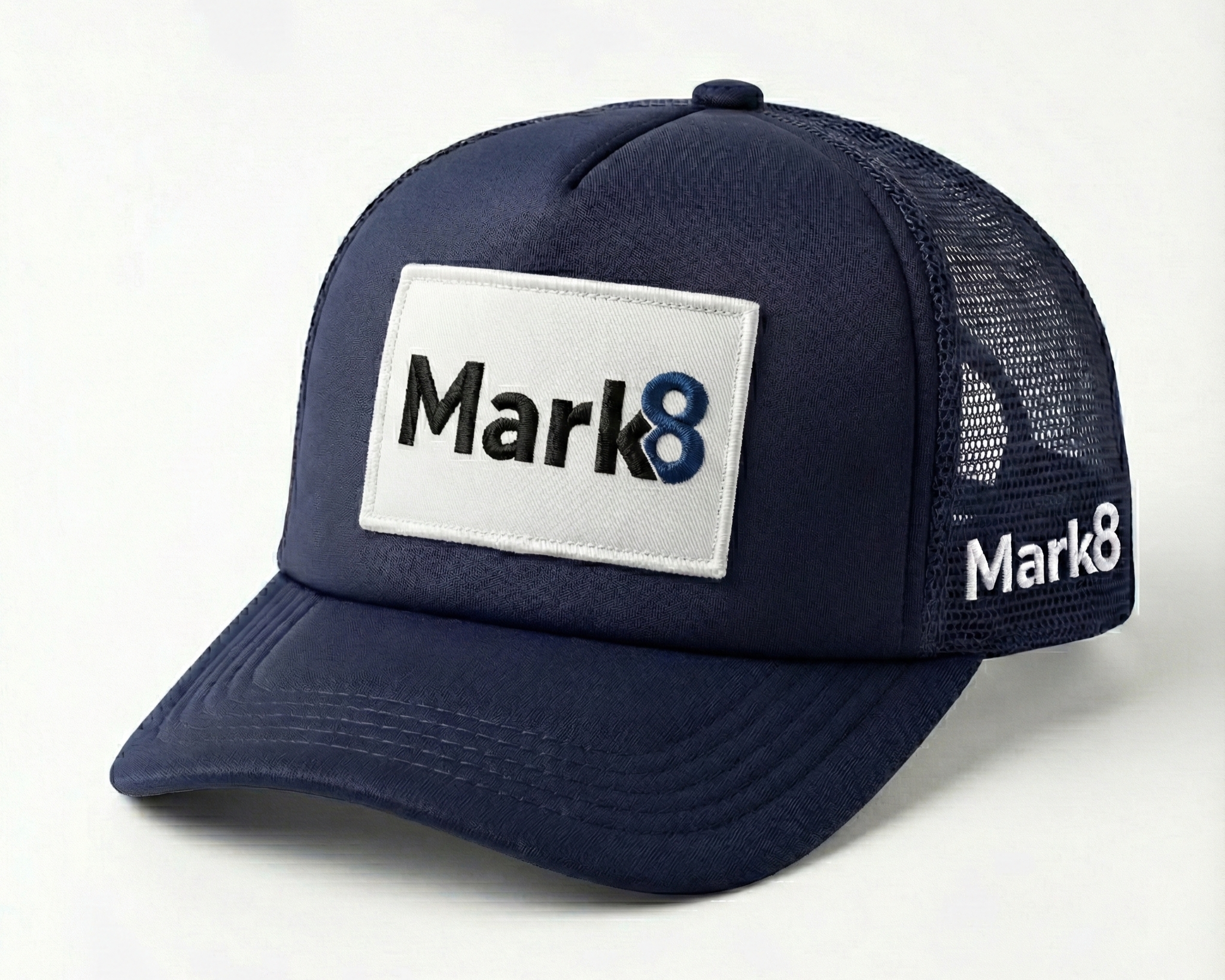 Navy Richardson-style trucker hat with structured fit, mesh back, and woven logo patch. A polished option for brands that want dependable visibility with a professional finish.