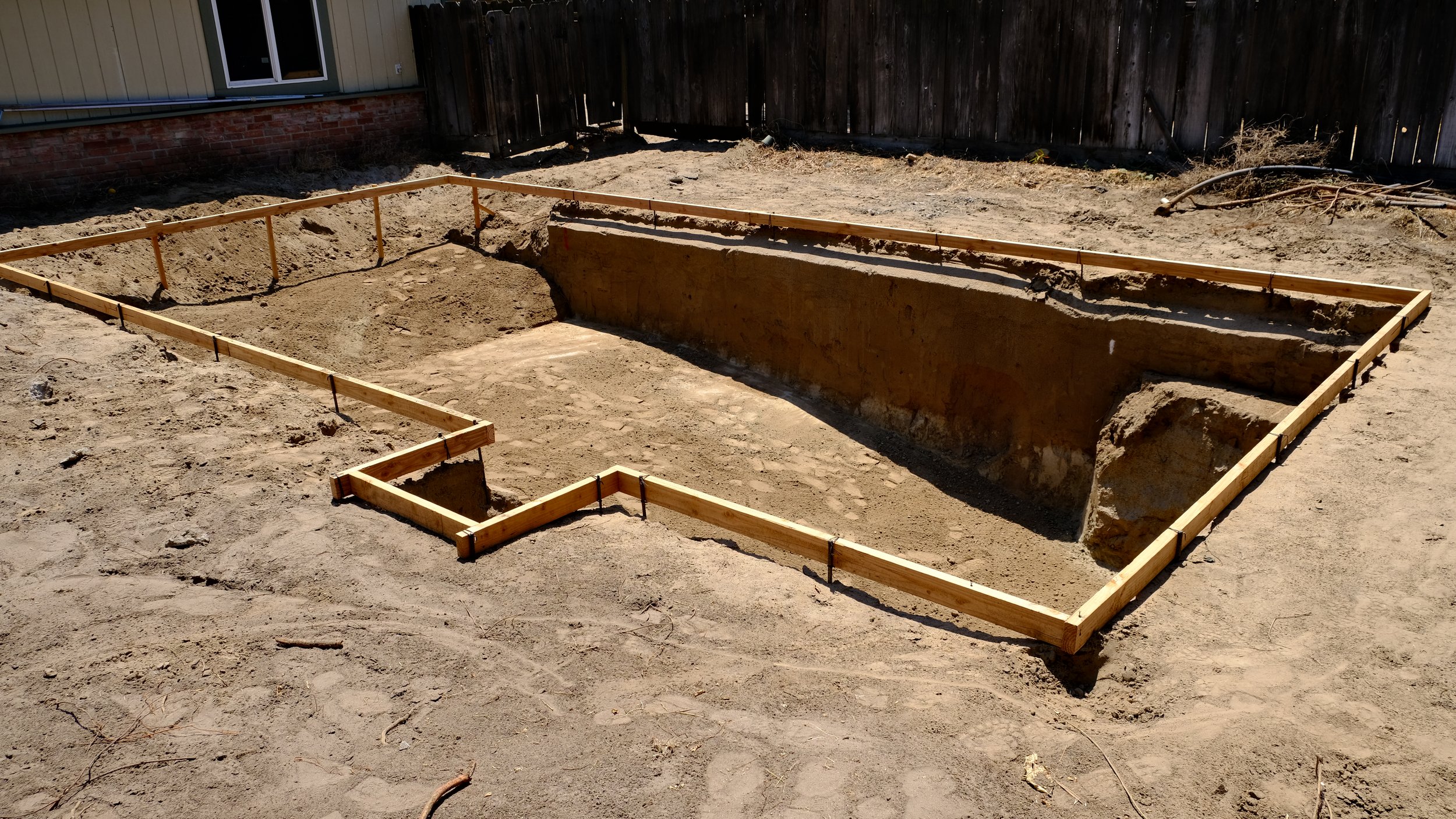 Pool excavation showing gunite shell during construction by NorCal Pools Inc in Northern California