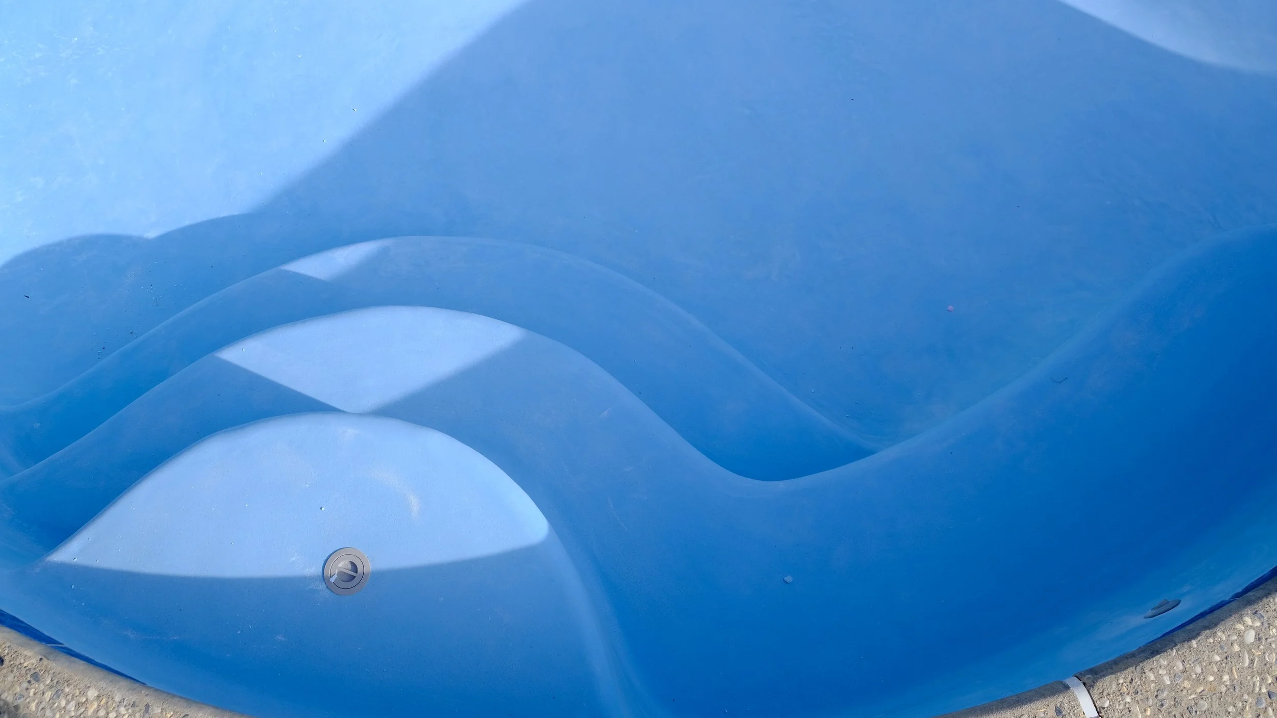 Pool remodel with blue plaster finish, steps, and mosaic turtle tile detail by NorCal Pools Inc in Northern California