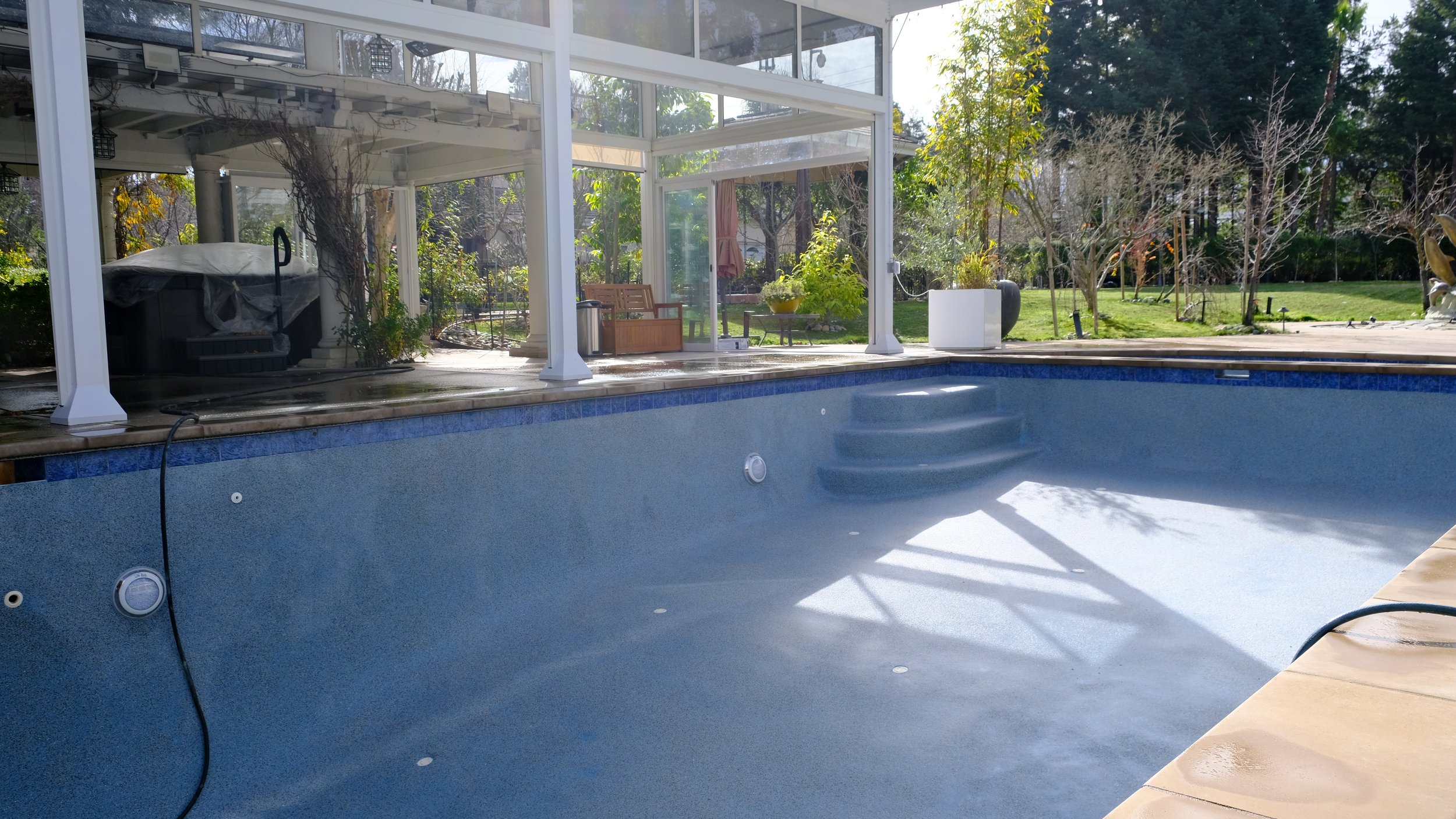 Pool resurfacing with aggregate finish application by NorCal Pools Inc in Atherton Northern California