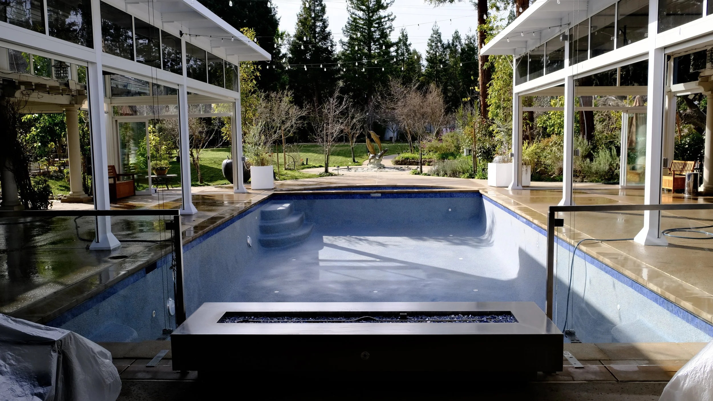 Pool remodel in Atherton California featuring new coping, tile, and blue plaster finish by NorCal Pools Inc
