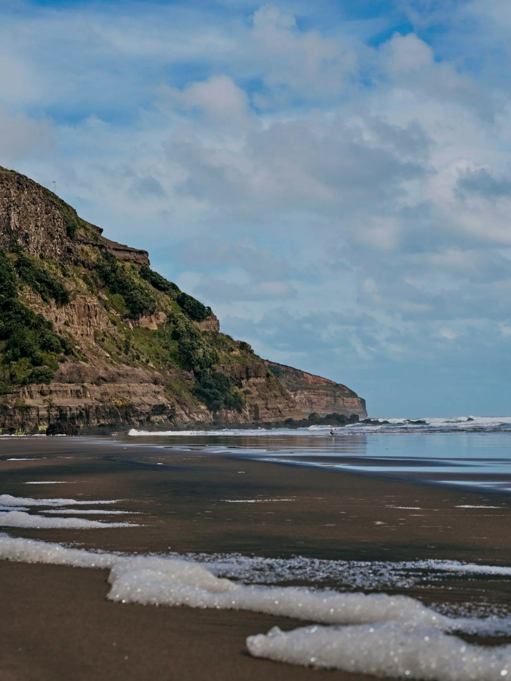 Muriwai Beach, grounding and mindfulness with beach walks. Accessible naturopathic recommendation of using sunlight, outdoor/green space, and the ocean as a grounding, mental wellness support