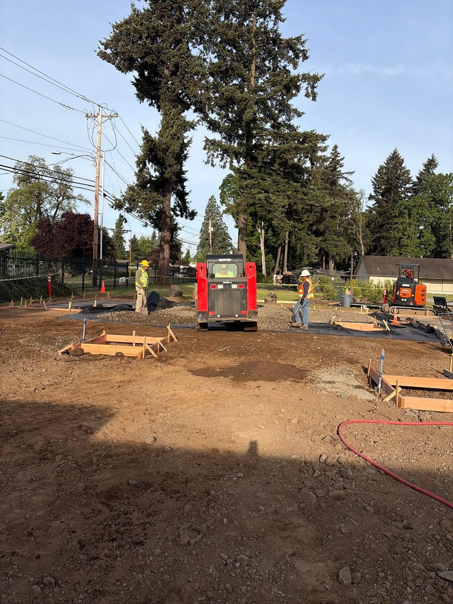 crew-forming-concrete-pads-skid-steer-oregon-military-museum-left-coast-gc.jpg