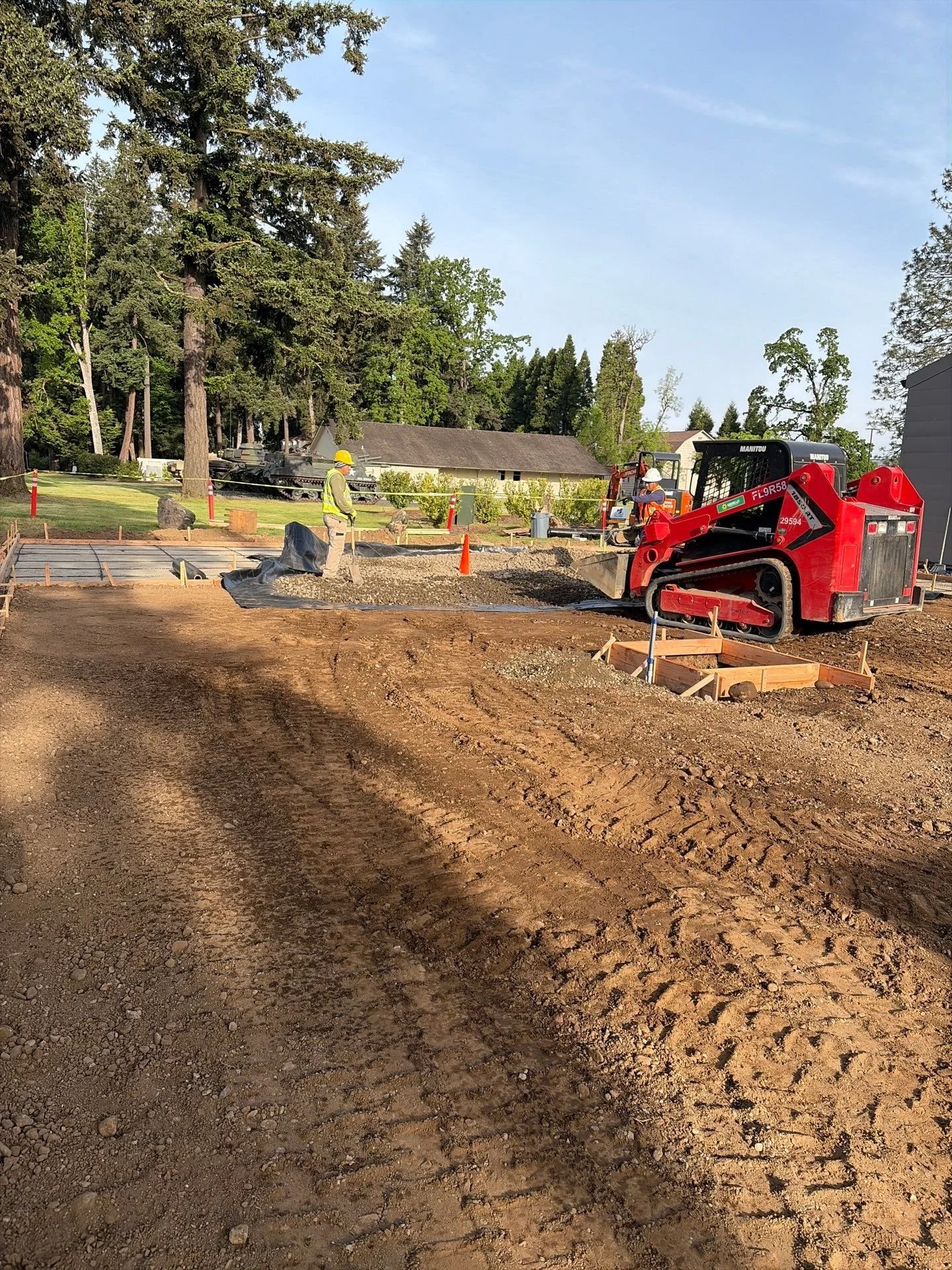 skid-steer-spreading-gravel-base-oregon-military-museum-left-coast-gc.jpg