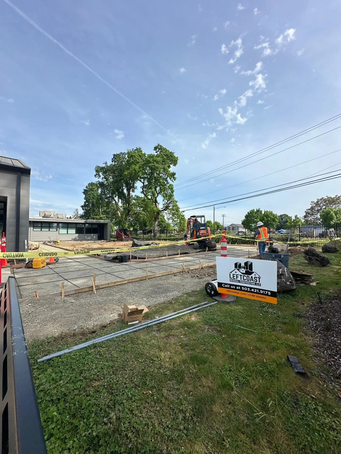 formed-concrete-plaza-jobsite-sign-oregon-military-museum-left-coast-gc.jpg