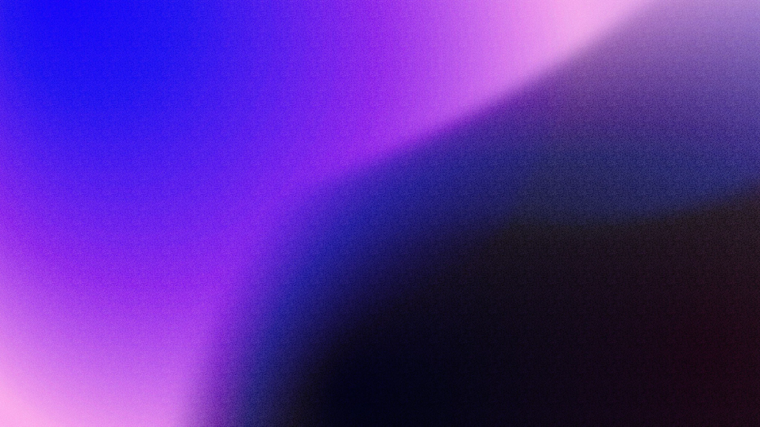 Blurred abstract background with shades of purple, blue, and black.
