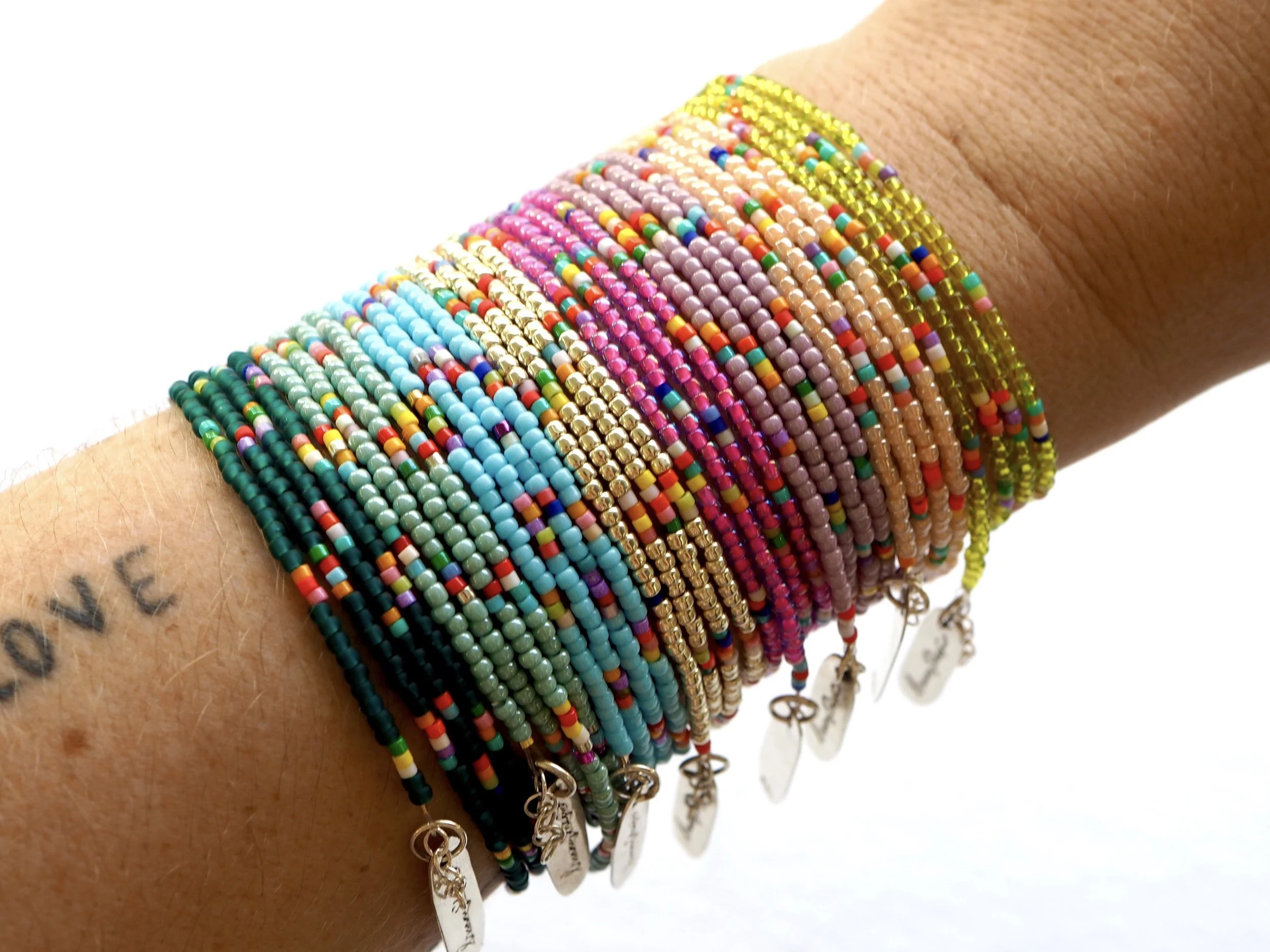 BUNNY SHAPIRO'S ICONIC MULTICOLORED SEVI WRAP BRACELET THAT ARE THE PERFECT SPRING AND SUMMER ACCESSORY.